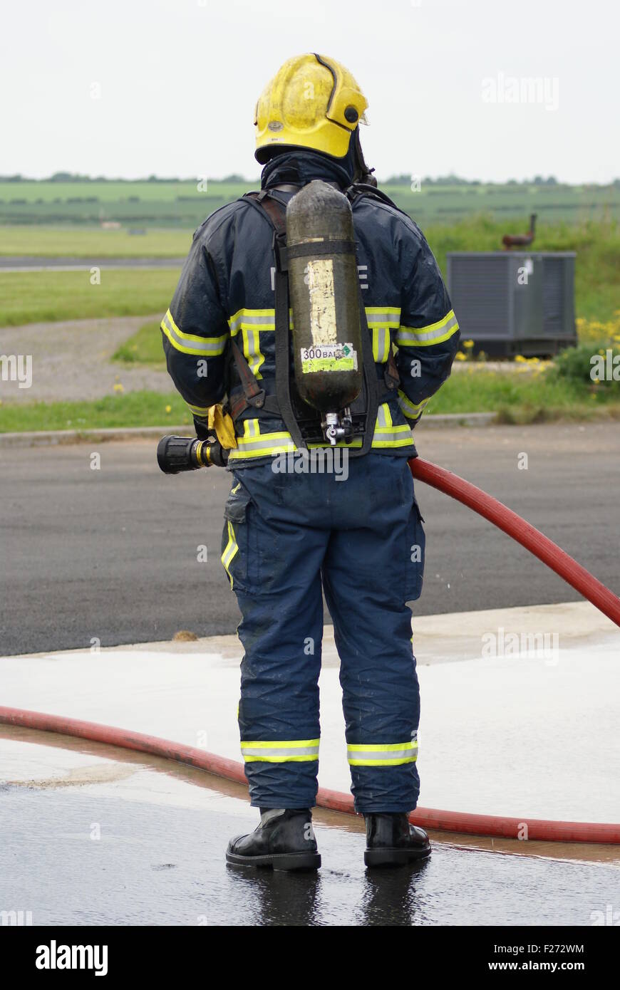 fire fighter wearing breathing apparatus Stock Photo Alamy