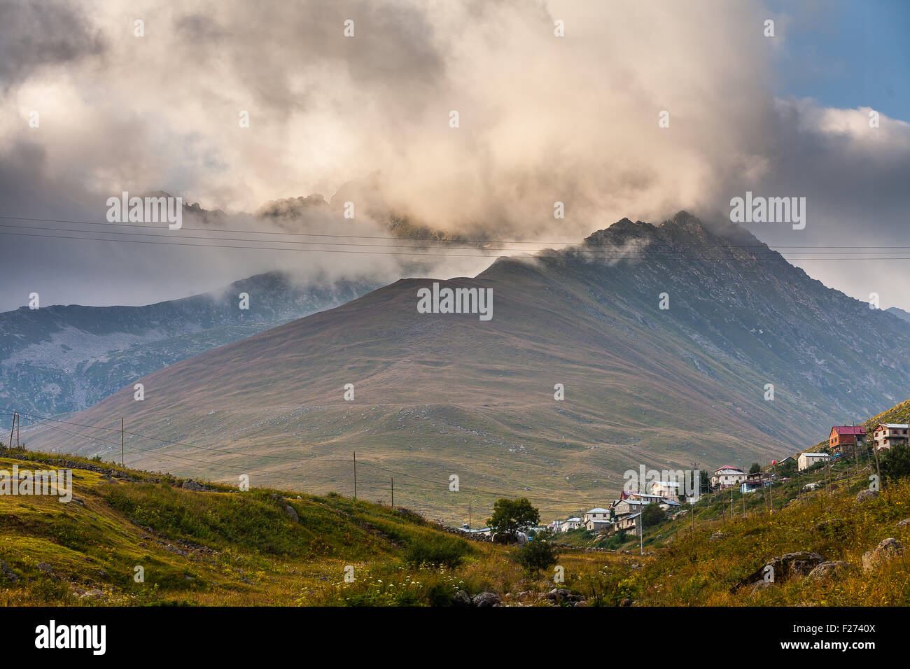 Mountain houses with clouds in Ayder Plateau, Rize, Turkey Stock Photo ...