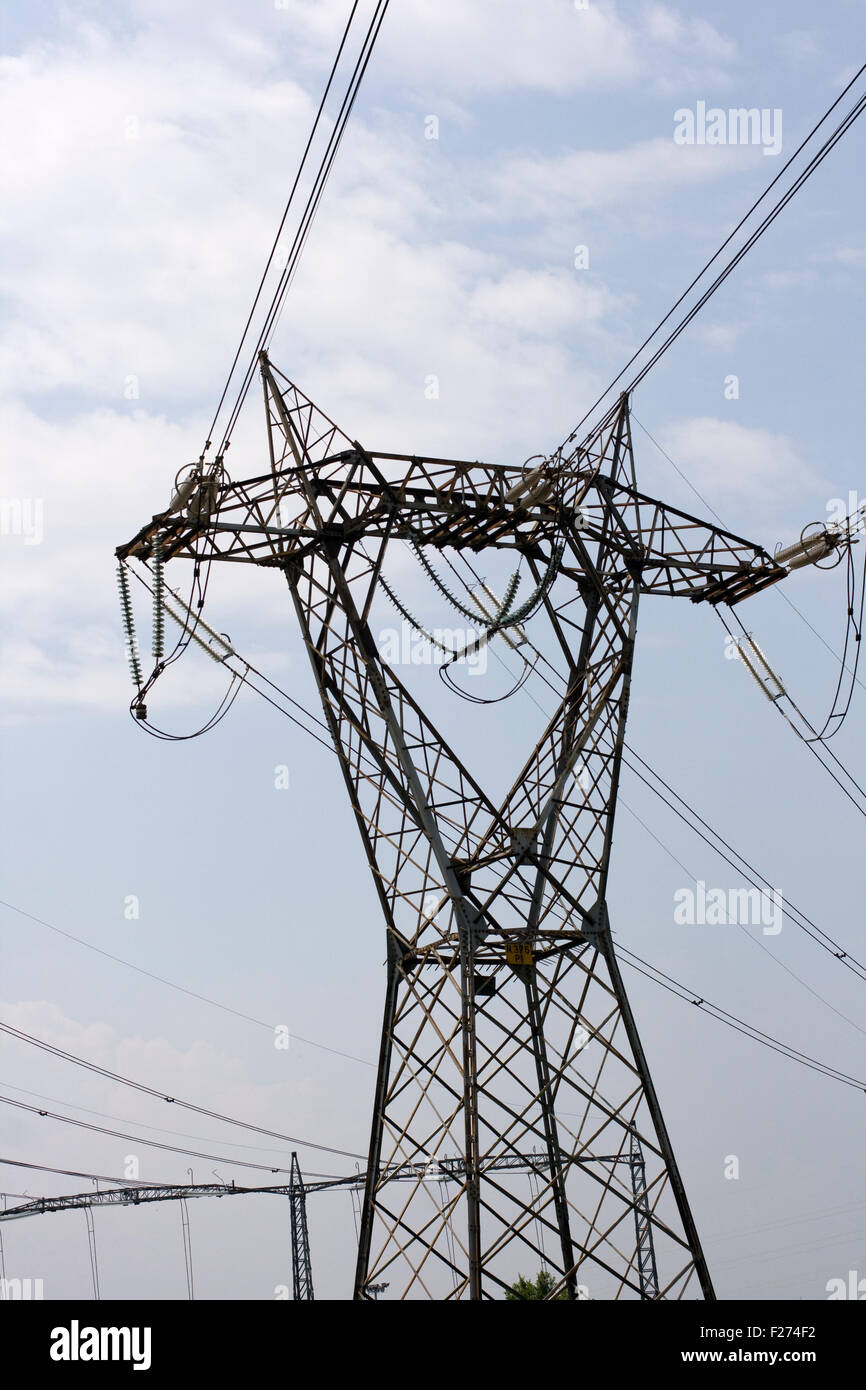 Electricity pylon on cloudy sky Stock Photo - Alamy