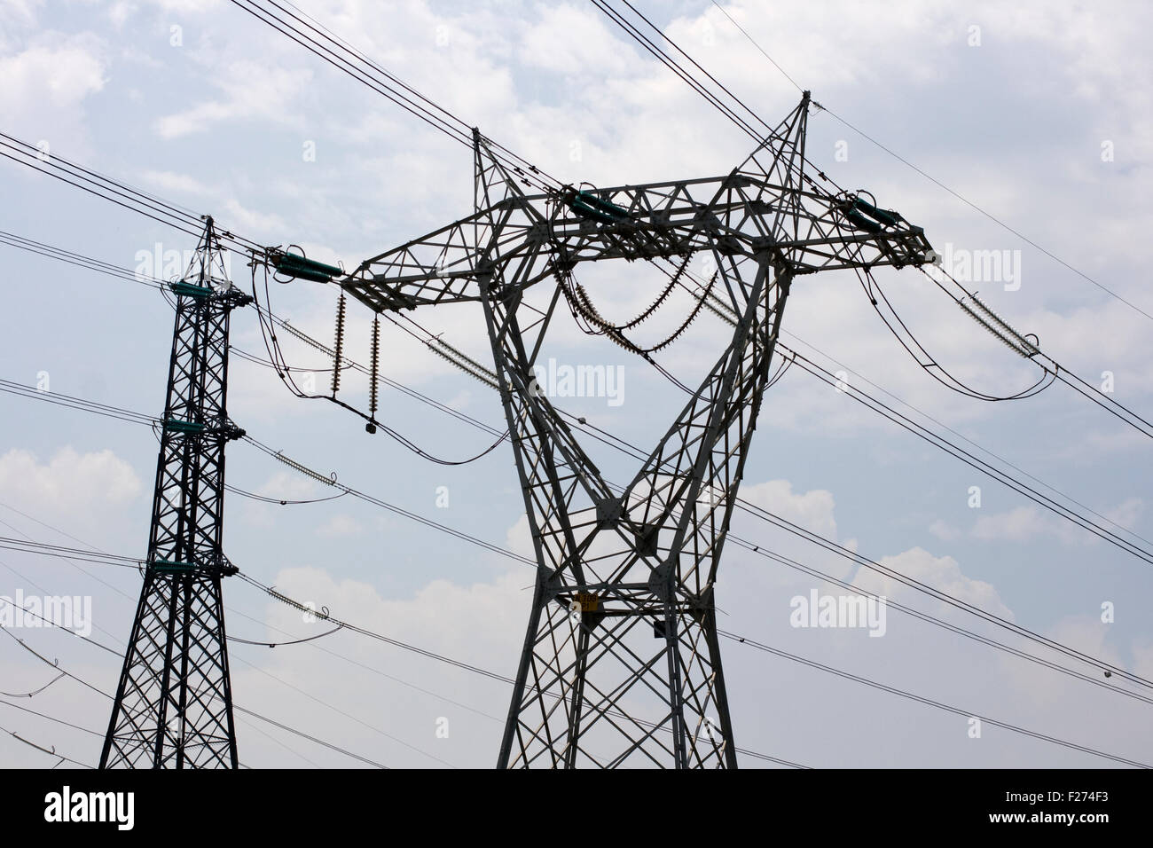 Electricity pylon on cloudy sky Stock Photo - Alamy