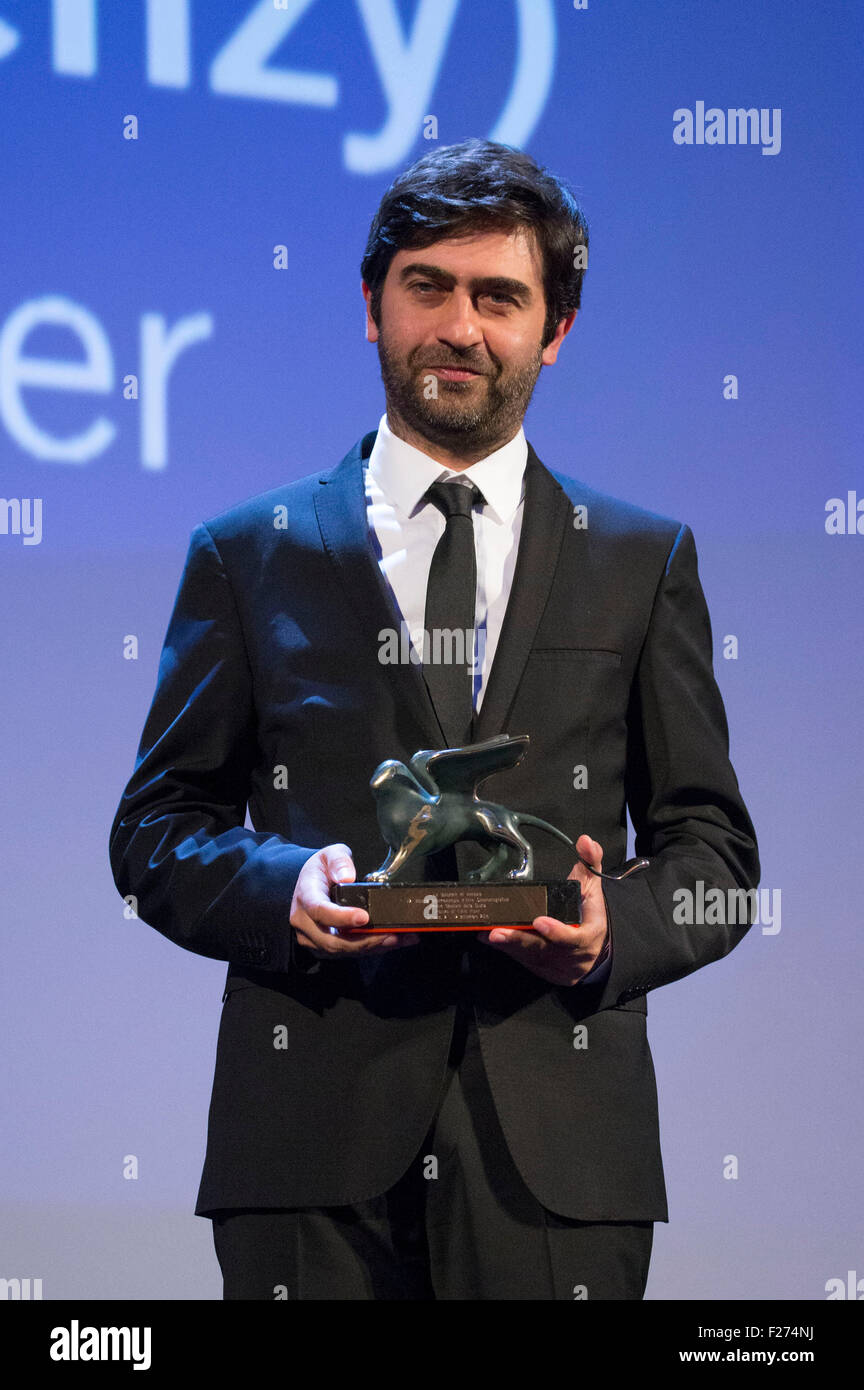 Venice, Italy. 12th Sep, 2015. Director Emin Alper poses with Lion Special Jury Award for the movie 'Abluka/Frenzy' during the closing ceremony and premiere of 'Lao Pao Er' at the 72nd Venice International Film Festival on September 12, 2015 in Venice, Italy. © dpa/Alamy Live News Stock Photo