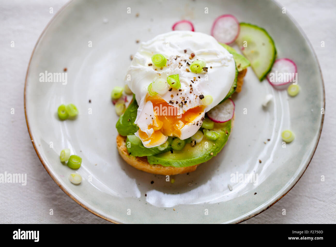 Toast with avocado and poached egg Stock Photo