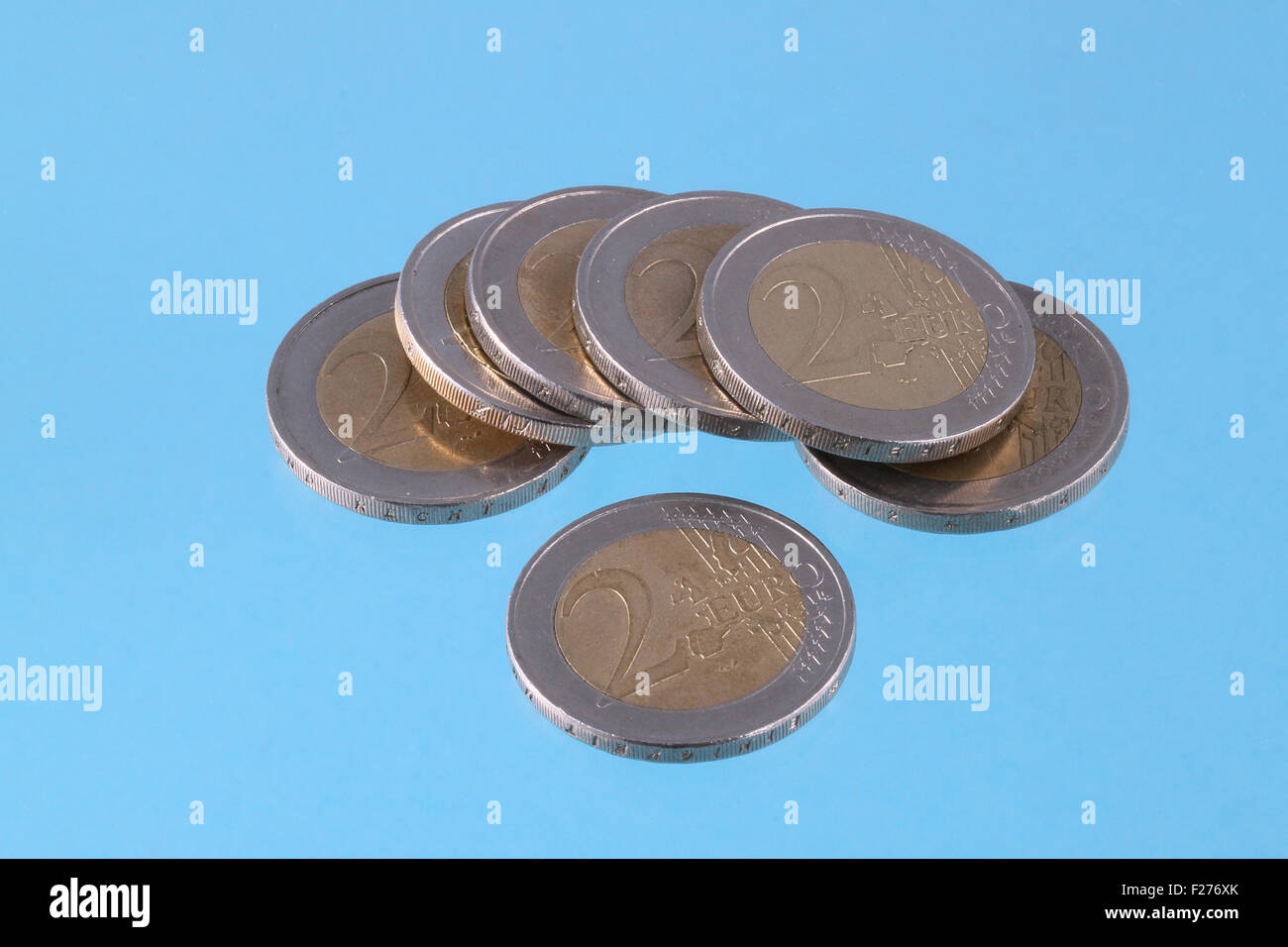 Close up photo of Euro coins on a blue chromakey background Stock Photo