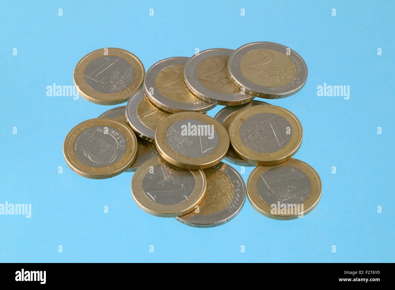 Close up photo of Euro coins on a blue chromakey background Stock Photo ...