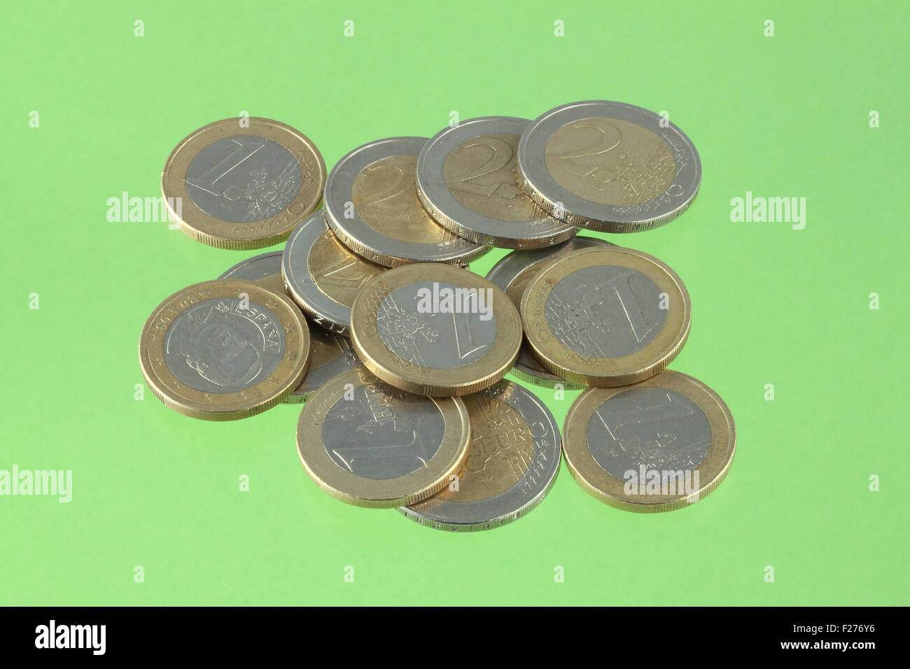 Close up photo of Euro coins on a green chromakey background Stock ...