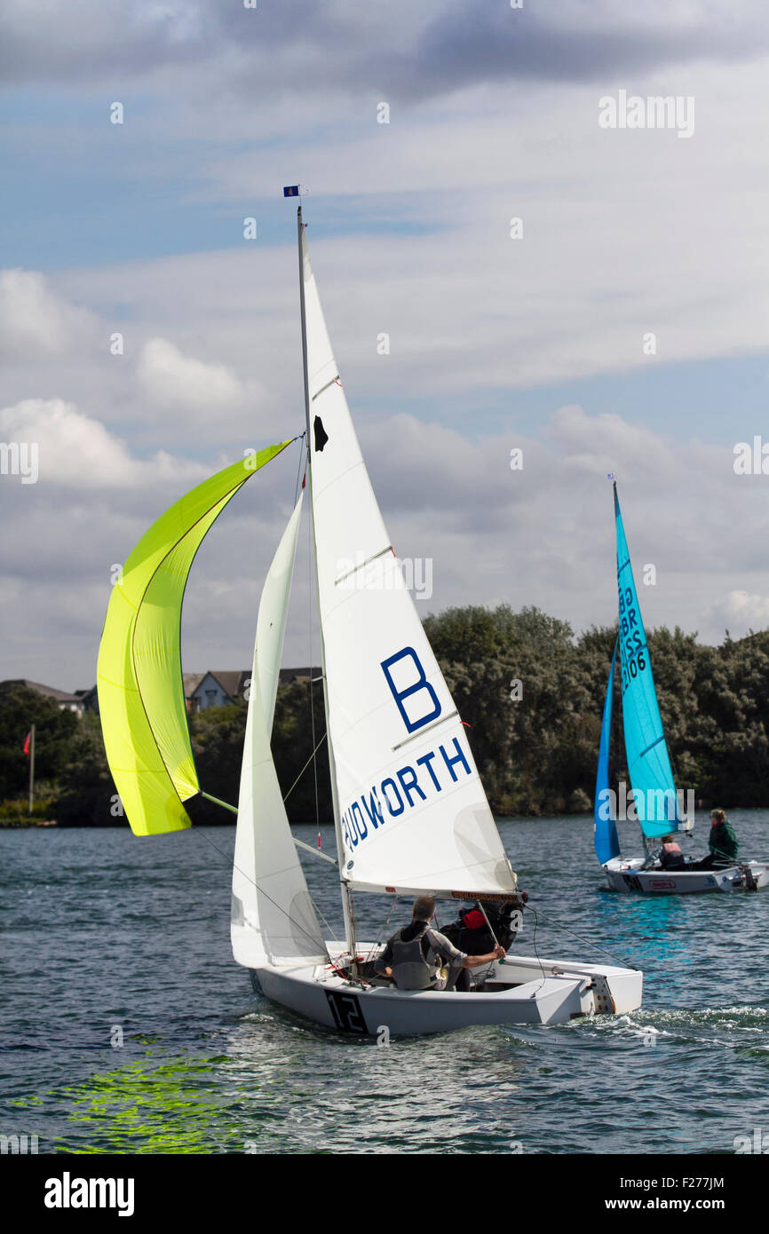 Southport, Merseyside, UK. 13th September, 2015. The Southport 24 Hour Race is a national sailing endurance race for two-handed sailing dinghies, with 63 Firefly, Lark, Enterprise and GP 14 boats competing. The race, hosted by the West Lancs Yacht Club, has a long history and is usually held in September. The race starts at 12 noon on the Saturday. The contestants then race their dinghies around the marine lake finishing at noon today.  During the hours of darkness, the helm and crew of each dinghy must keep a careful watch for other boats (often capsized). Stock Photo