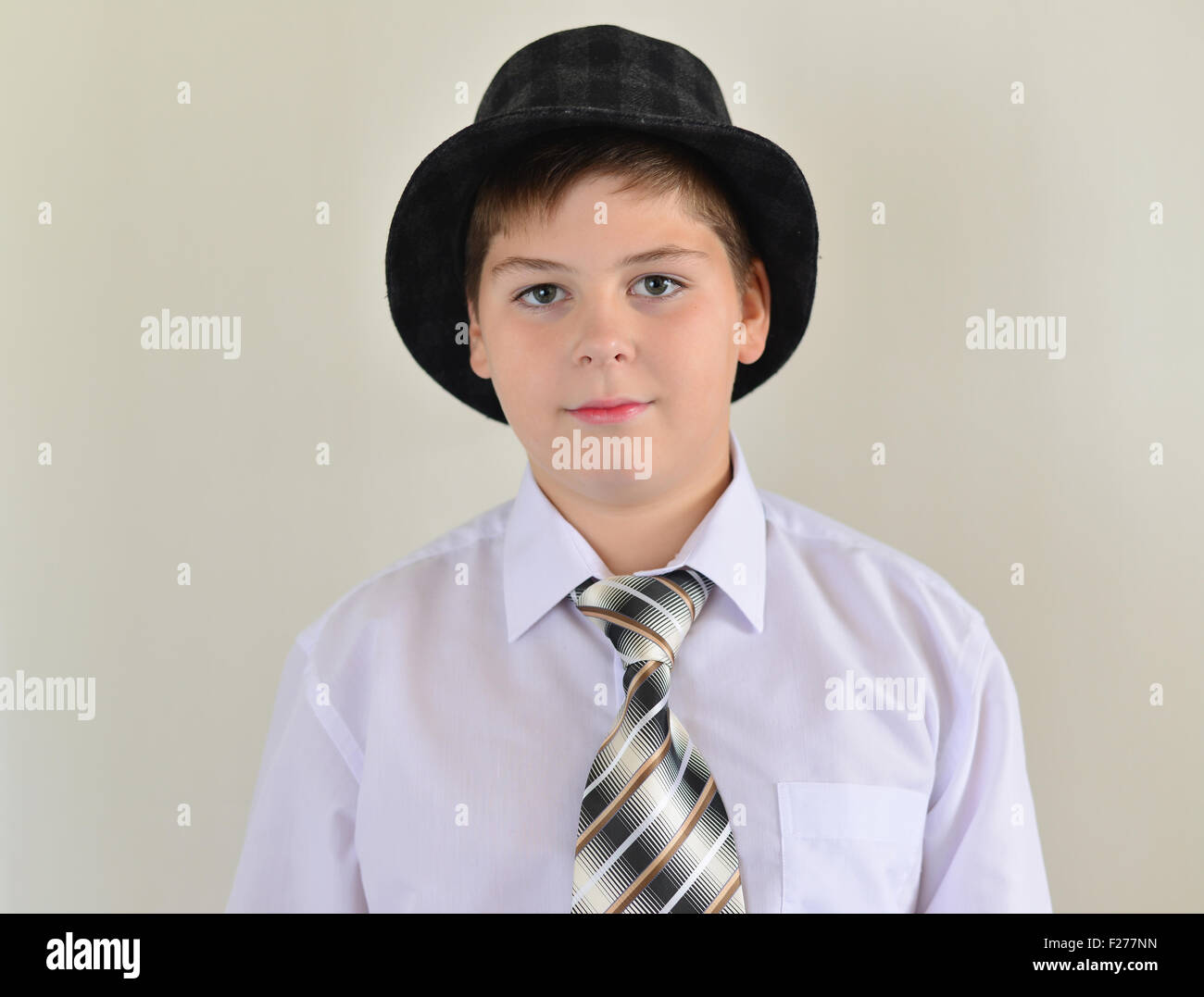 portrait of a teenage boy in a hat and tie Stock Photo Alamy