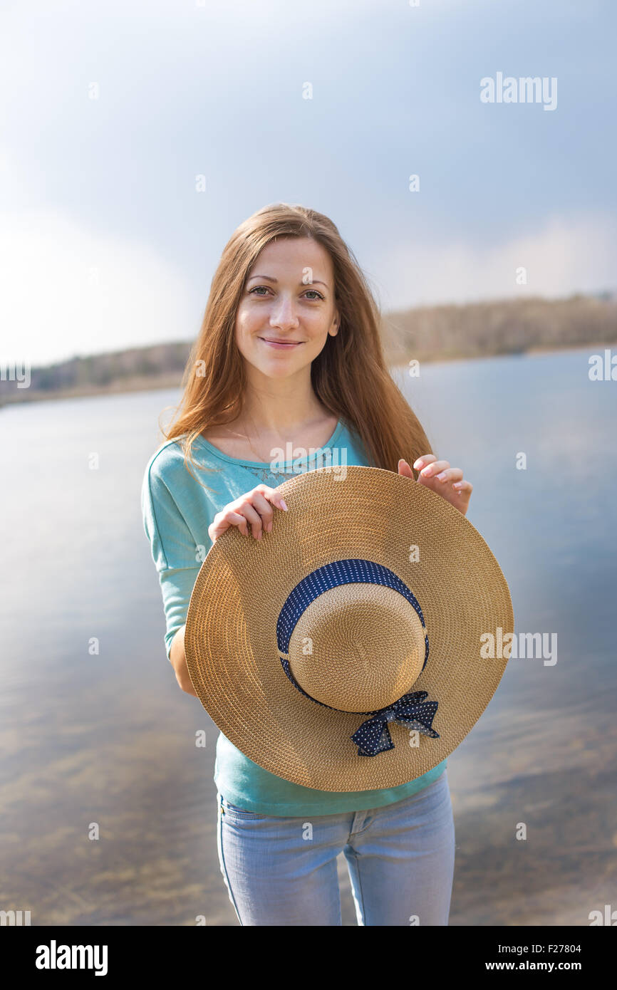 Holding her sun hat hi-res stock photography and images - Alamy