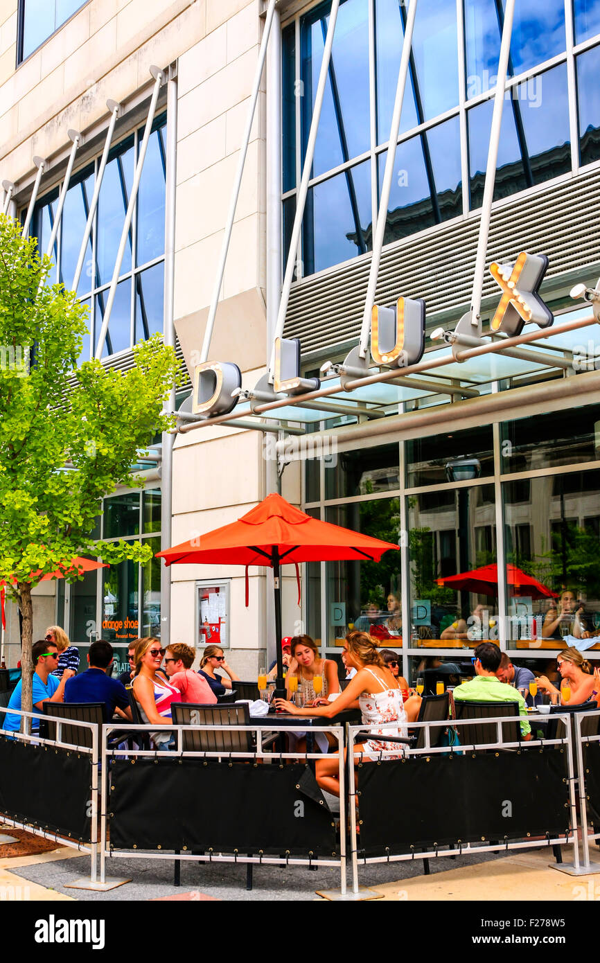 People sitting outside eating at the DLUX Bistro Restaurant in Madison Wisconsin Stock Photo