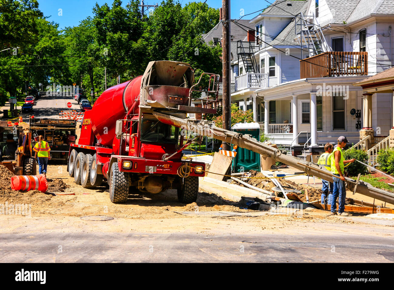 A commercial cement truck unloading at a development in Madison