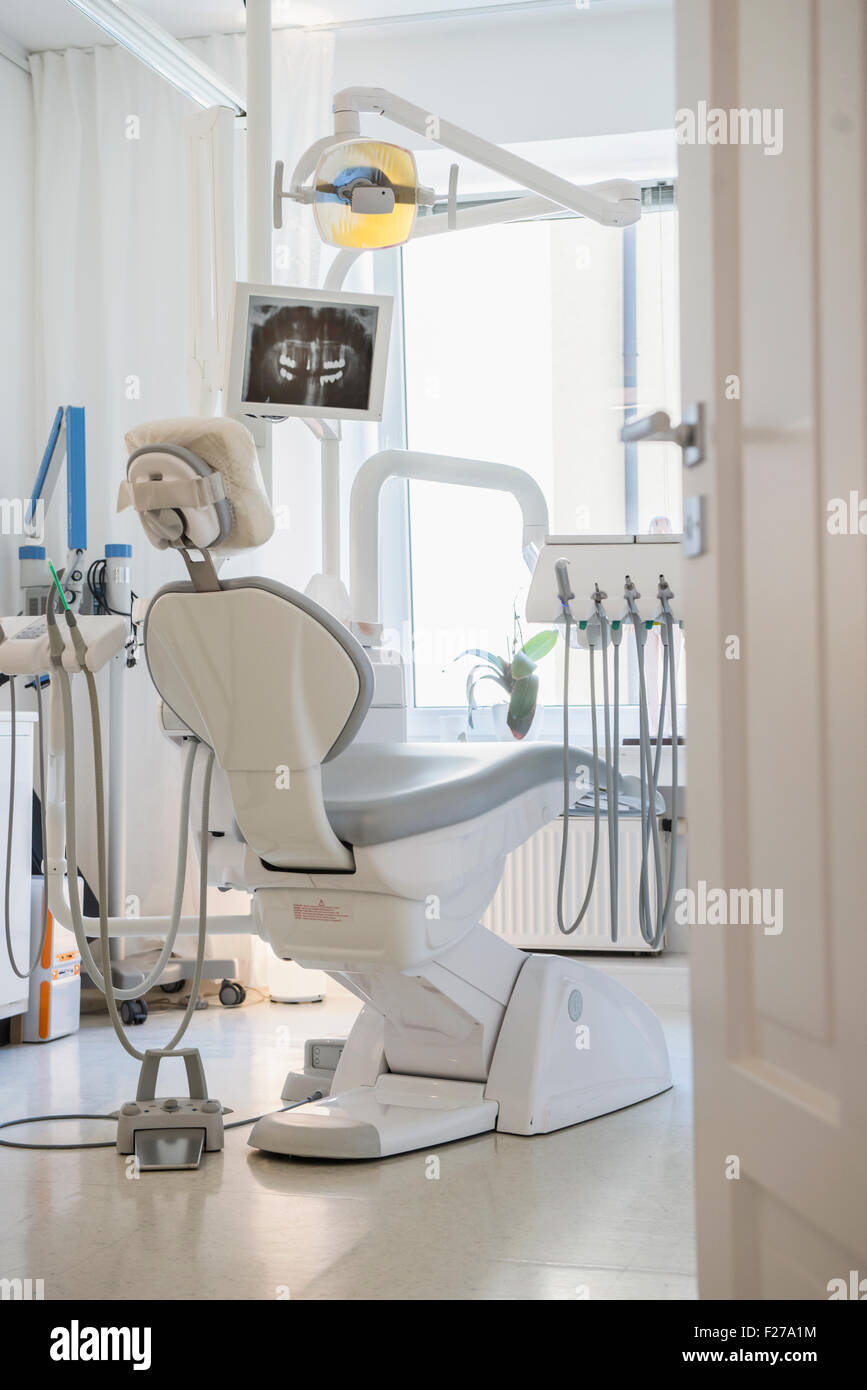 Dentist's chair facing screen with xray, Munich, Bavaria, Germany