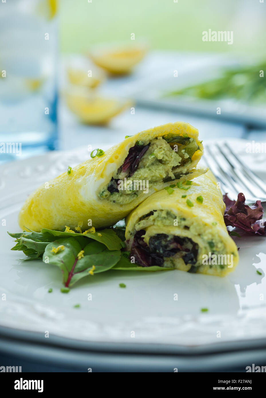 Pesto omelette with mixed greens and chives Stock Photo Alamy
