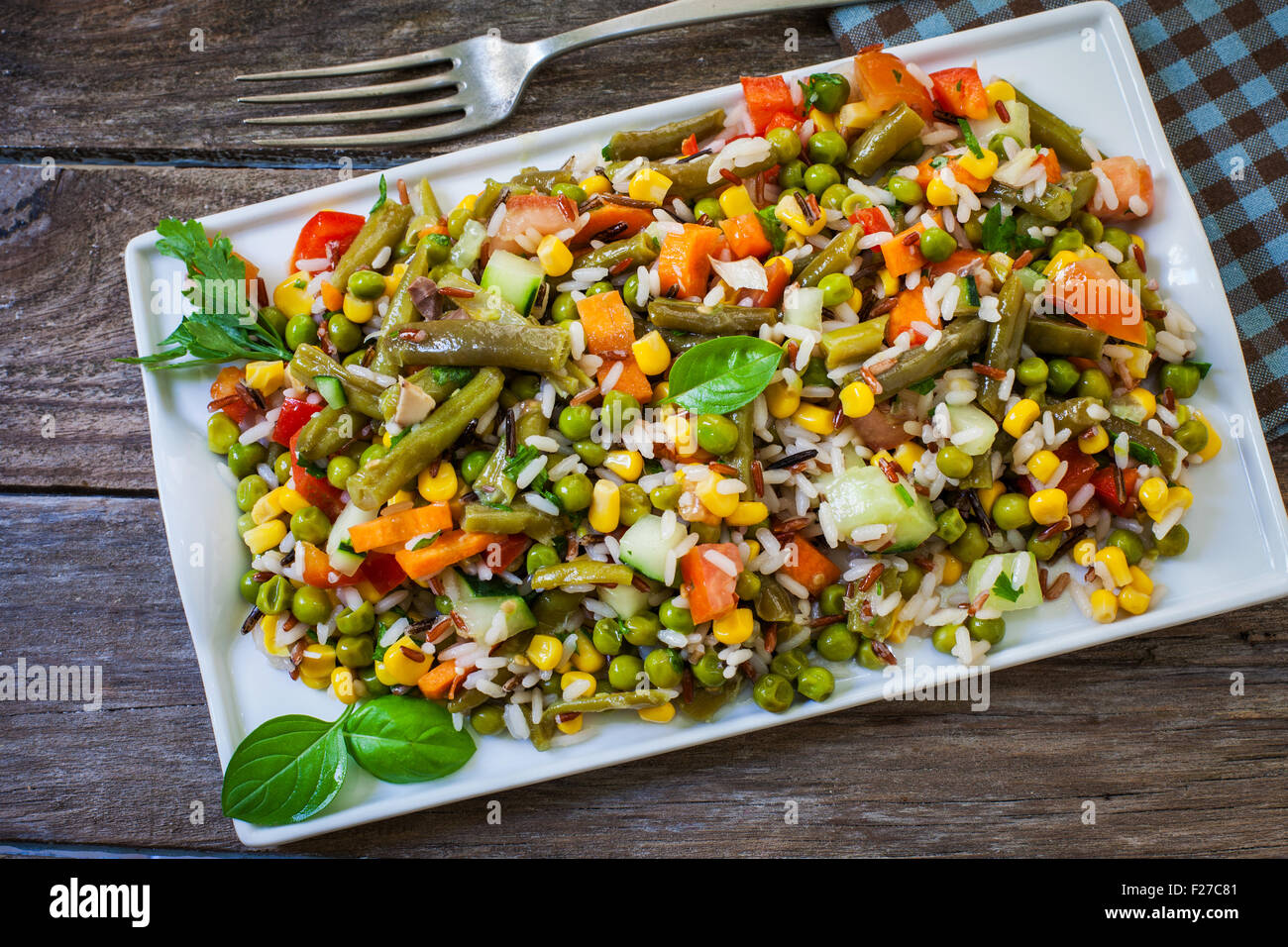 fresh rice salad with vegetables on white tray Stock Photo