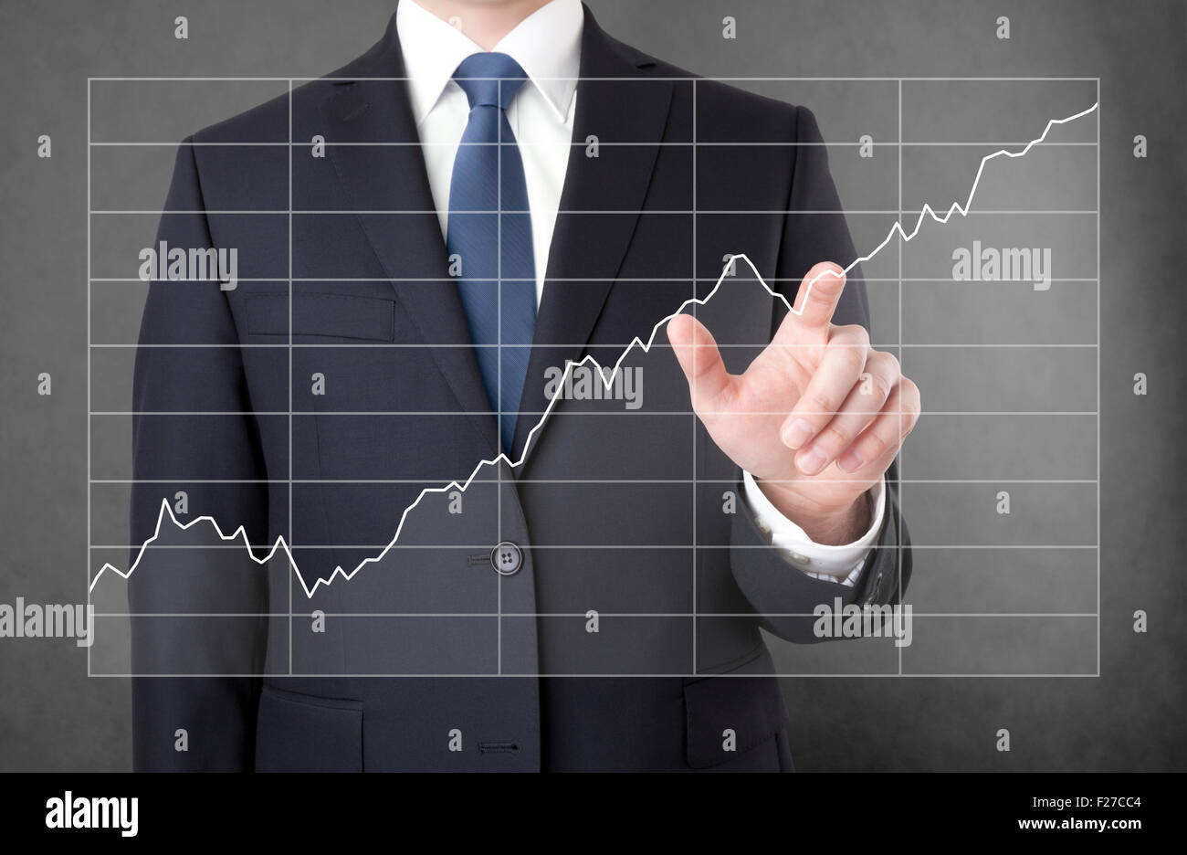 Businessman with growing chart Stock Photo - Alamy