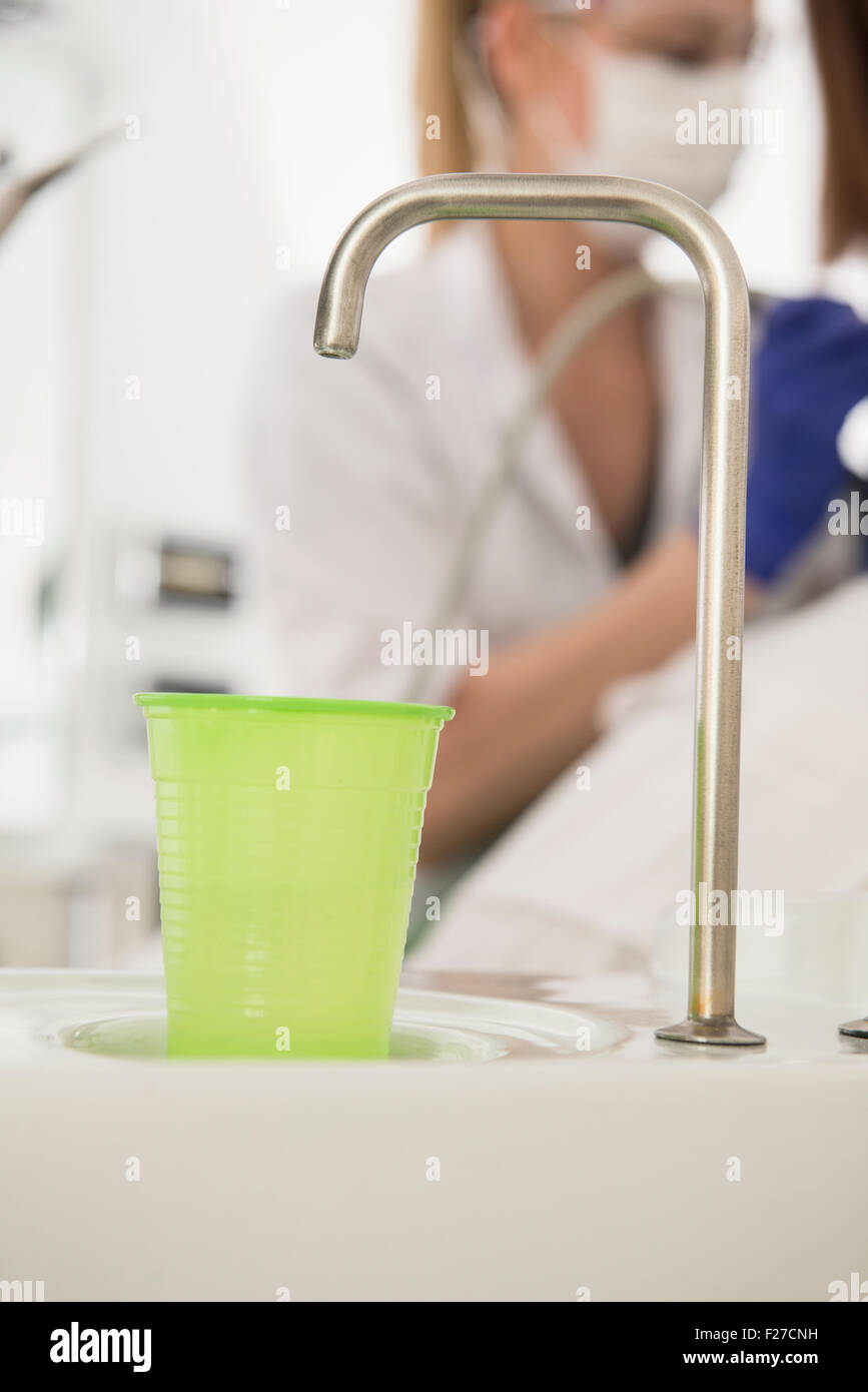 Dental cuspidor with a disposable cup in dental clinic, Munich, Bavaria, Germany Stock Photo Alamy