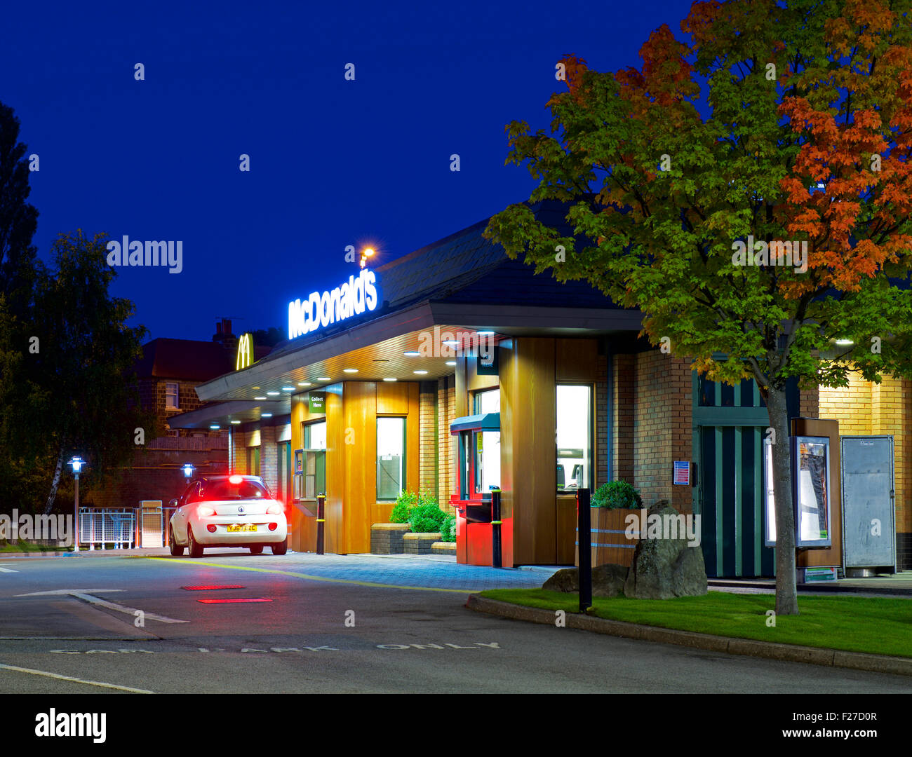 Car at McDonald's drive-in restaurant, at night, England UK Stock Photo