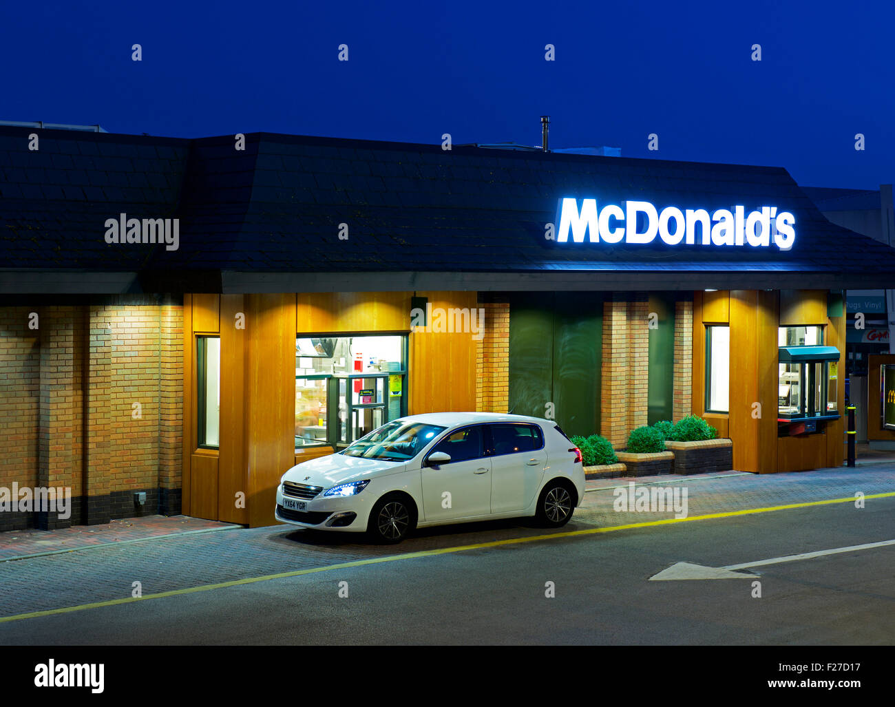 Car at McDonald's drive-in restaurant, at night, England UK Stock Photo