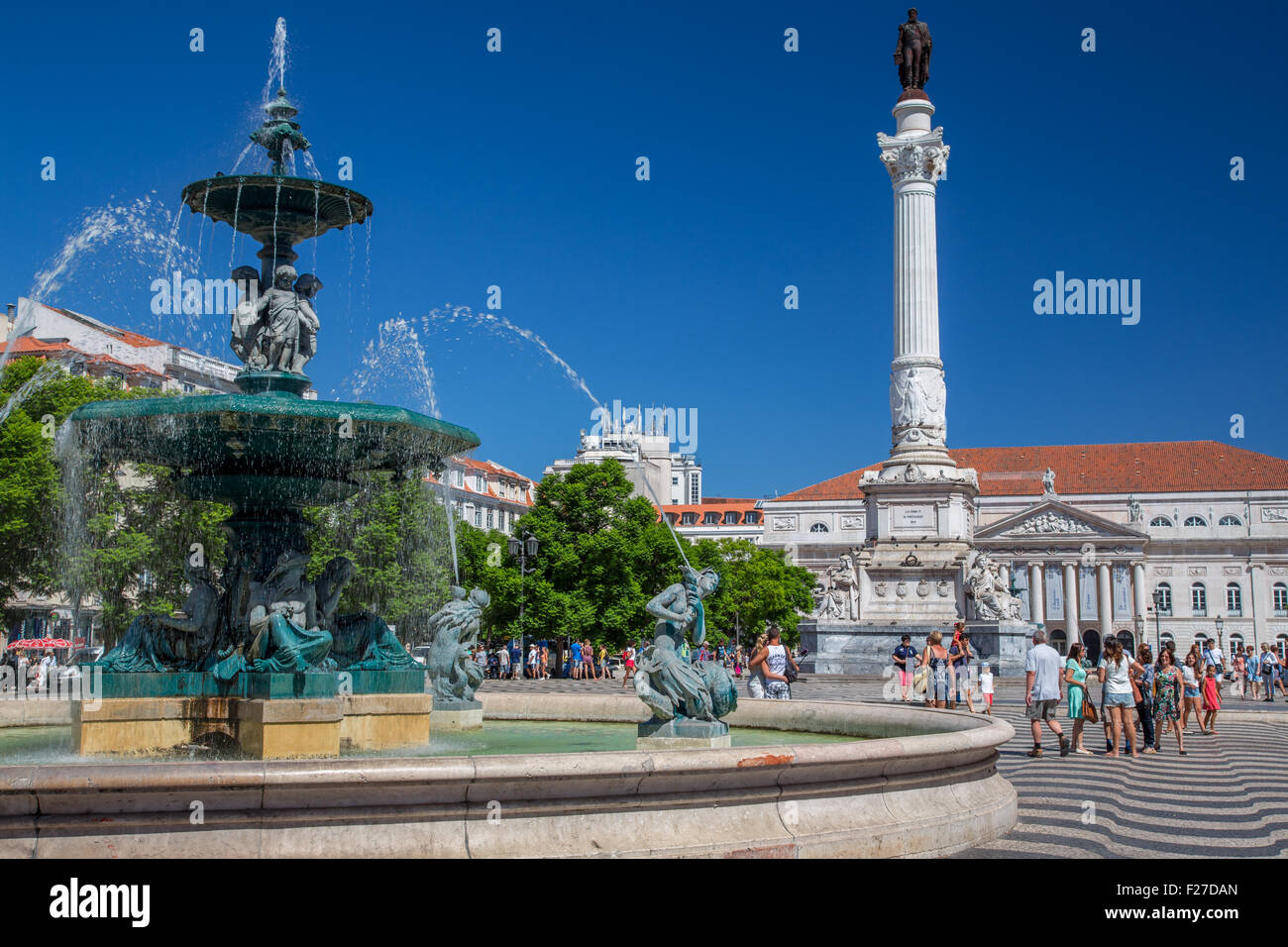 Place du Rossio, Praca Dom Pedro, fountain, column and National Theatre, Lisbon, Portugal Stock Photo