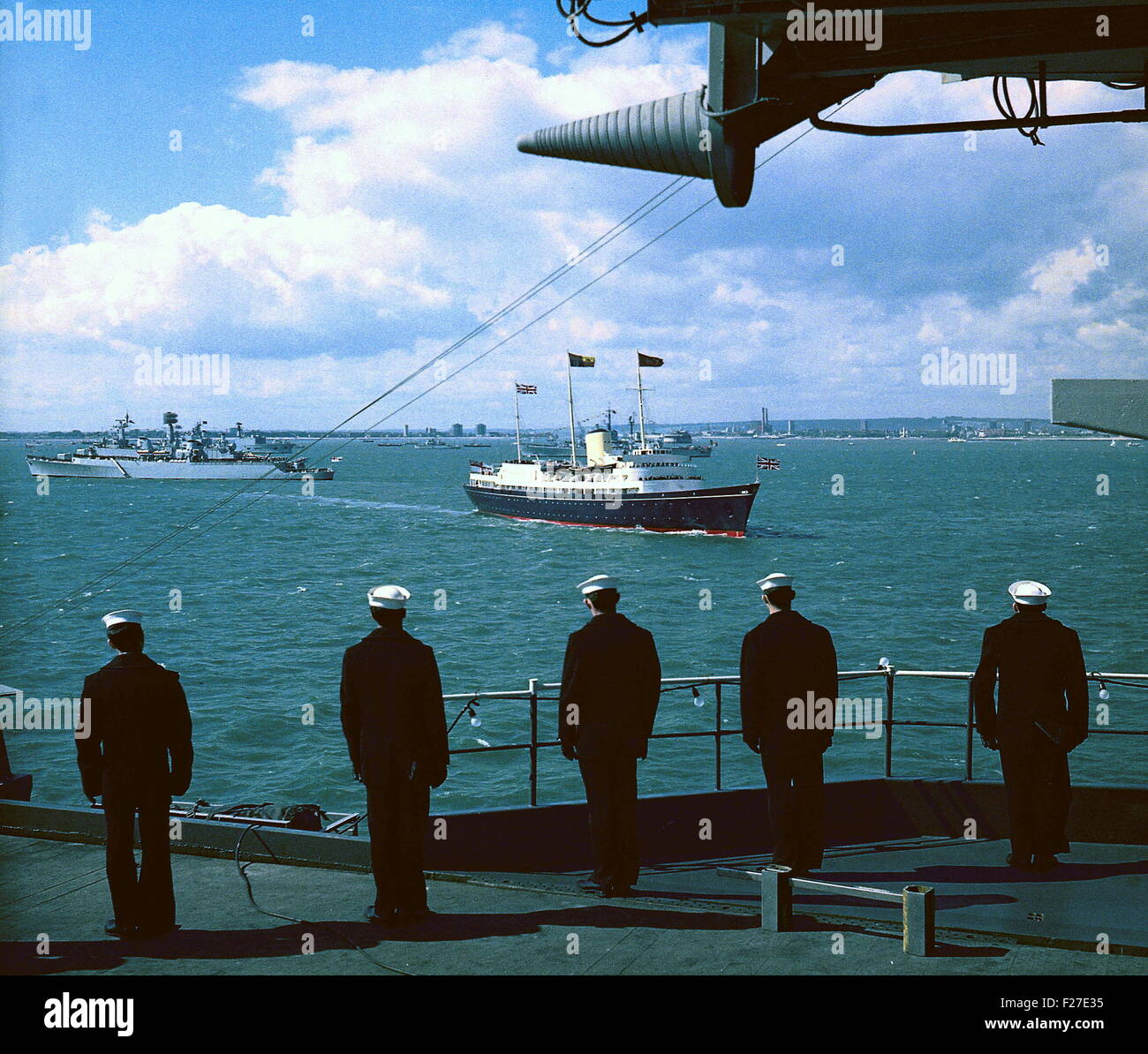 AJAXNETPHOTO - (PMO) 16 MAY 1969. SPITHEAD, ENGLAND. - ROYAL INSPECTION - THE ROYAL YACHT BRITANNIA CARRYING QUEEN ELIZABETH II, THE DUKE OF EDINBURGH AND PRINCESS ANNE, PICTURED OFF SPITHEAD FROM THE DECK OF THE USS WASP, DURING THE ROYAL REVIEW OF 61 WARSHIPS OF TWELVE N.A.T.O. (NORTH ATLANTIC TREATY ORGANISATION) COUNTRIES.  PHOTO:JONATHAN EASTLAND/AJAX REF:C6919 10C Stock Photo