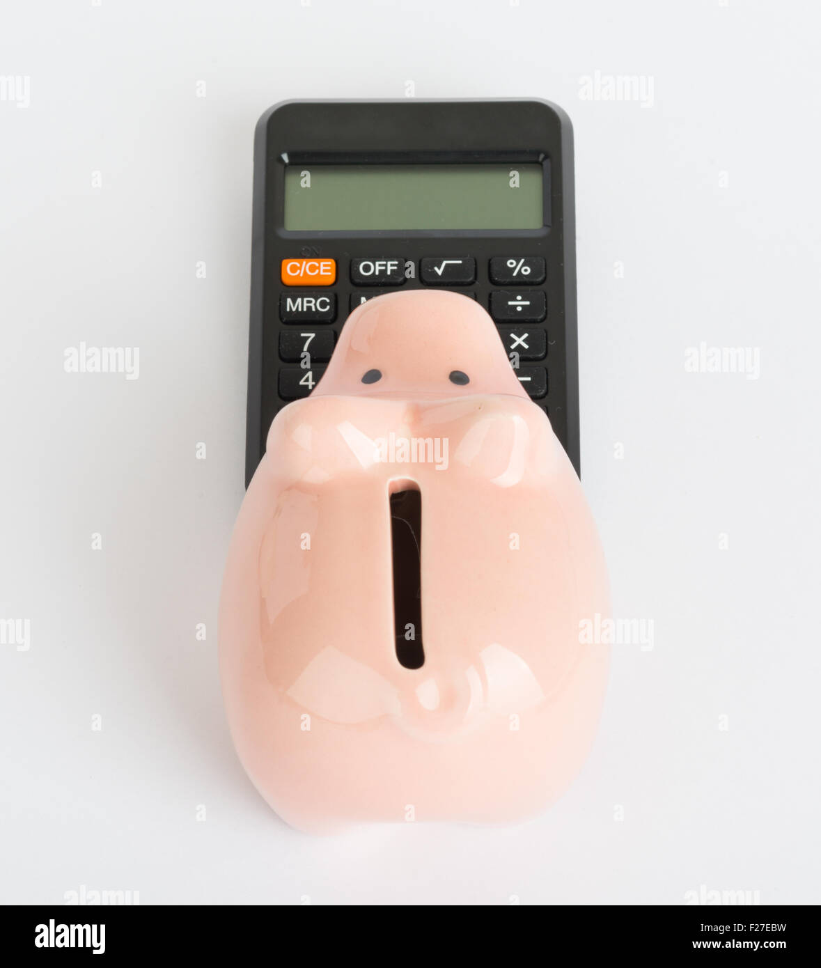 Piggy bank with calculator Stock Photo Alamy