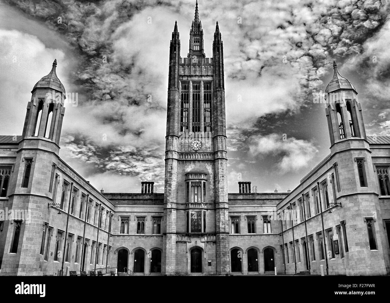 marischal college Aberdeen Scotland council dark moody clouds turrets clock tower courtyard door ways Stock Photo