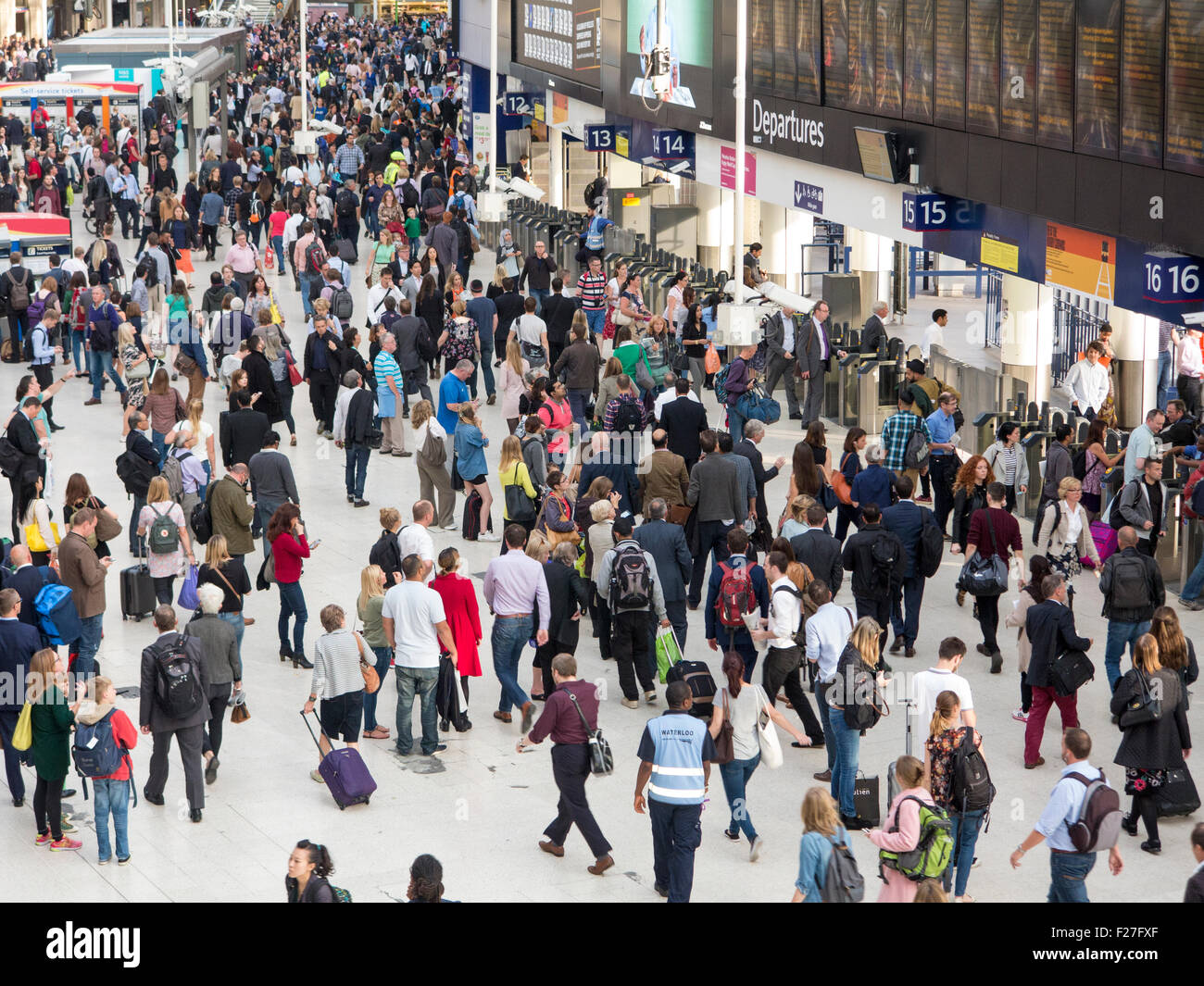 Crowds of people rushing to get home from work after a long day at work Stock Photo