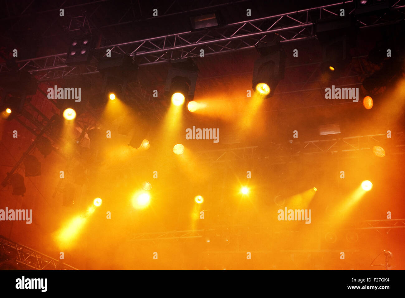 Various orange stage lights in the dark Stock Photo