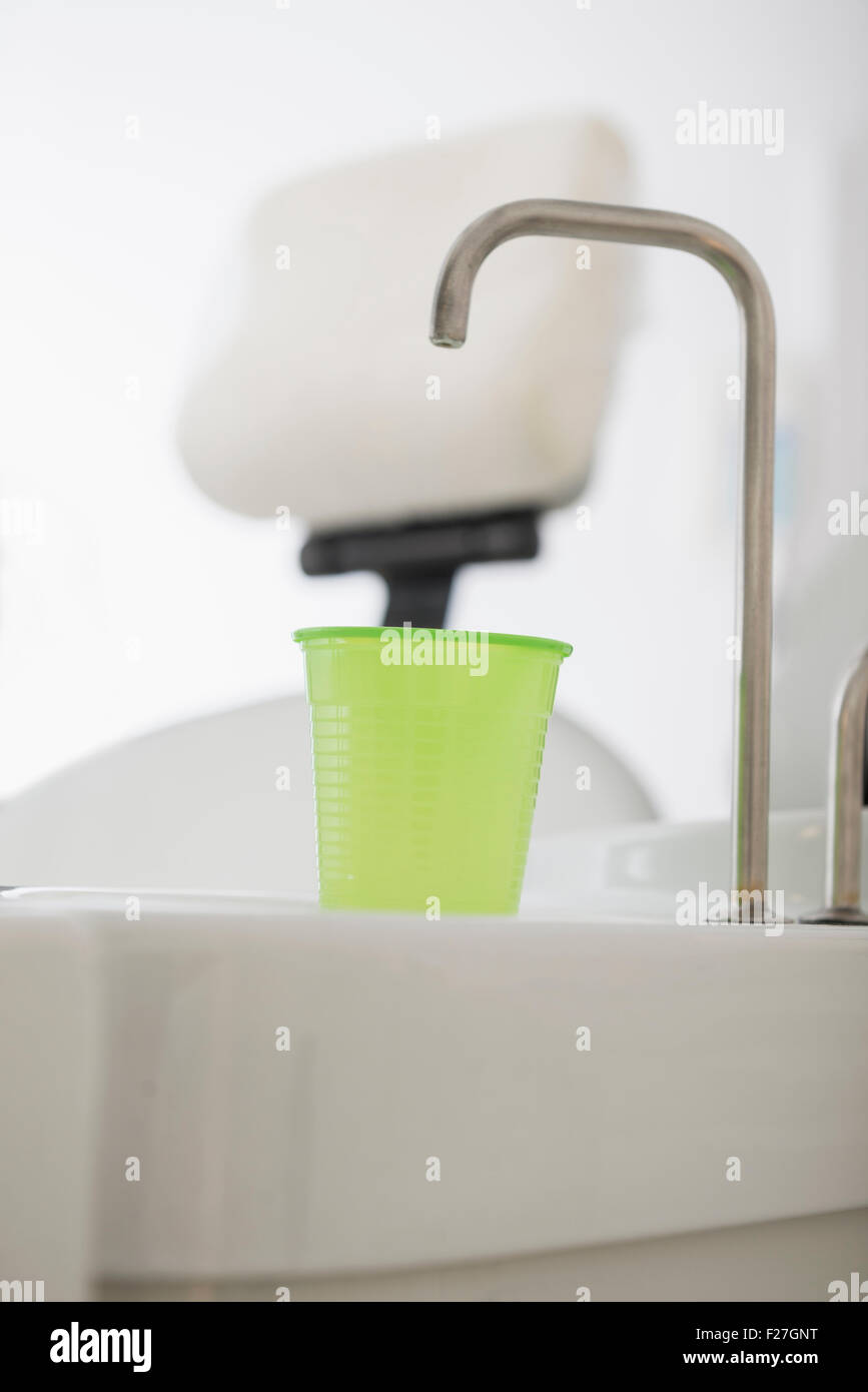 Dental cuspidor with a disposable cup in dental clinic, Munich, Bavaria