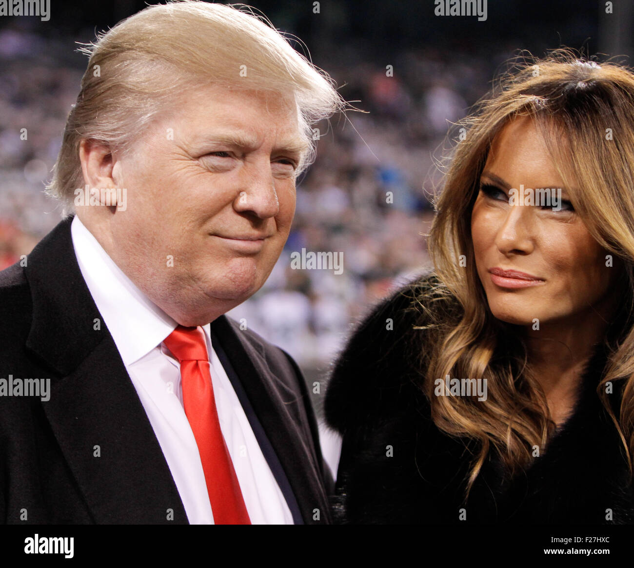 Donald Trump and wife Melania Trump at a football game at MetLife Stadium on November 13, 2011 in East Rutherford, New Jersey. Stock Photo