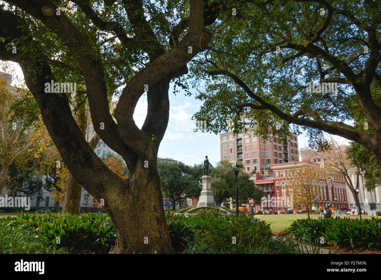 A lovely view of Lafayette Square with trees and statues located in the