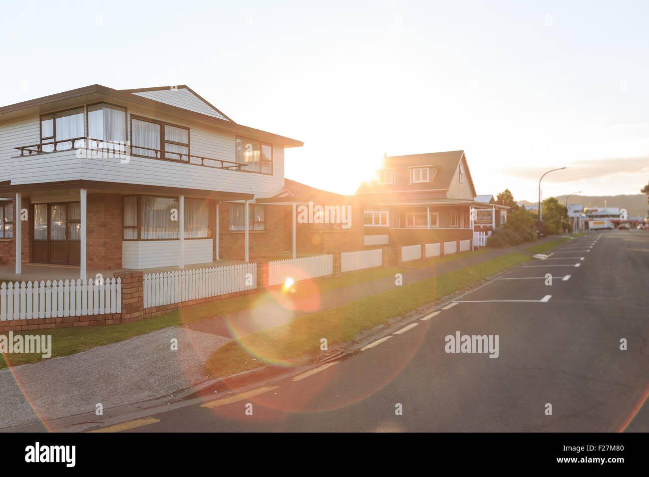 Sunset over family homes in a suburban area in Whitianga, New Zealand Stock Photo