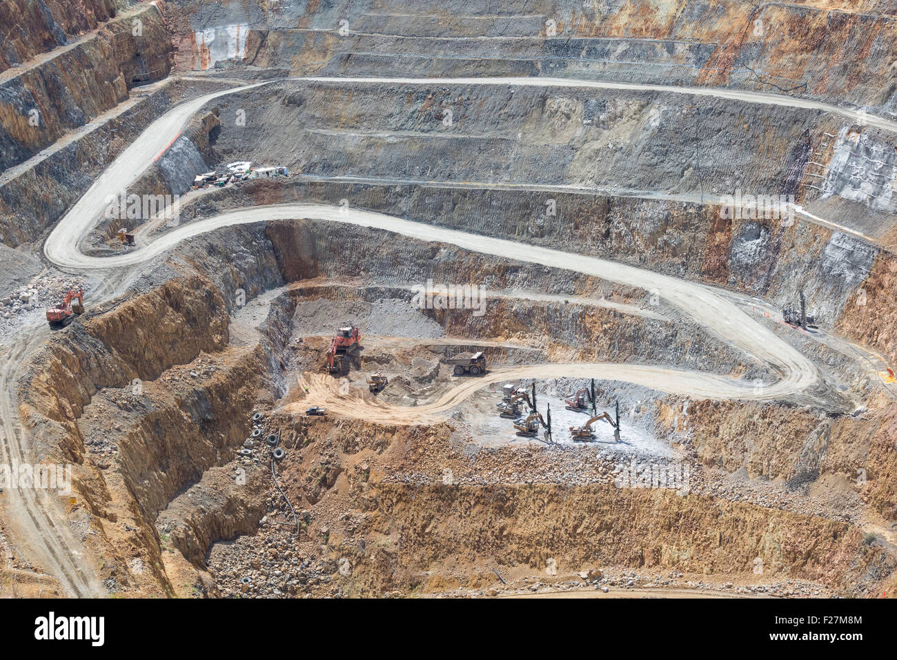 Bottom of surface mining and machinery in an open pit mine in Waihi, New Zealand Stock Photo