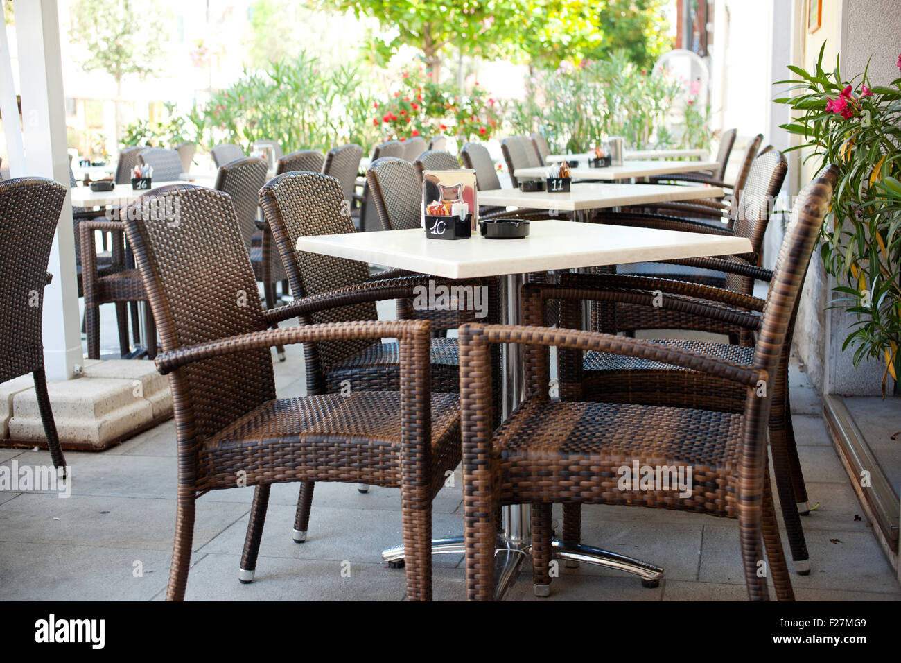 Table and wicker chairs of a coffee bar Stock Photo