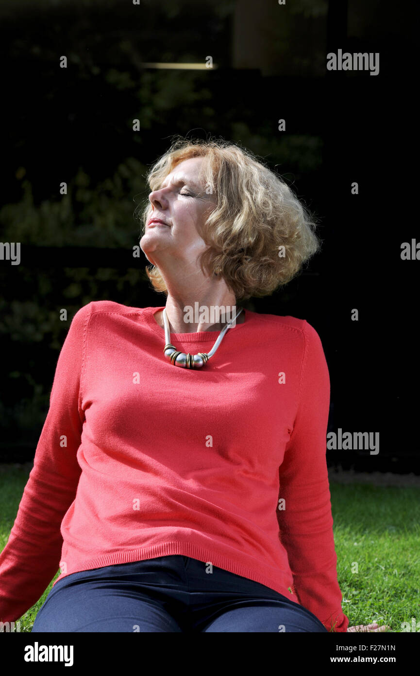 Mature woman sunbathing hi-res stock photography and images - Alamy