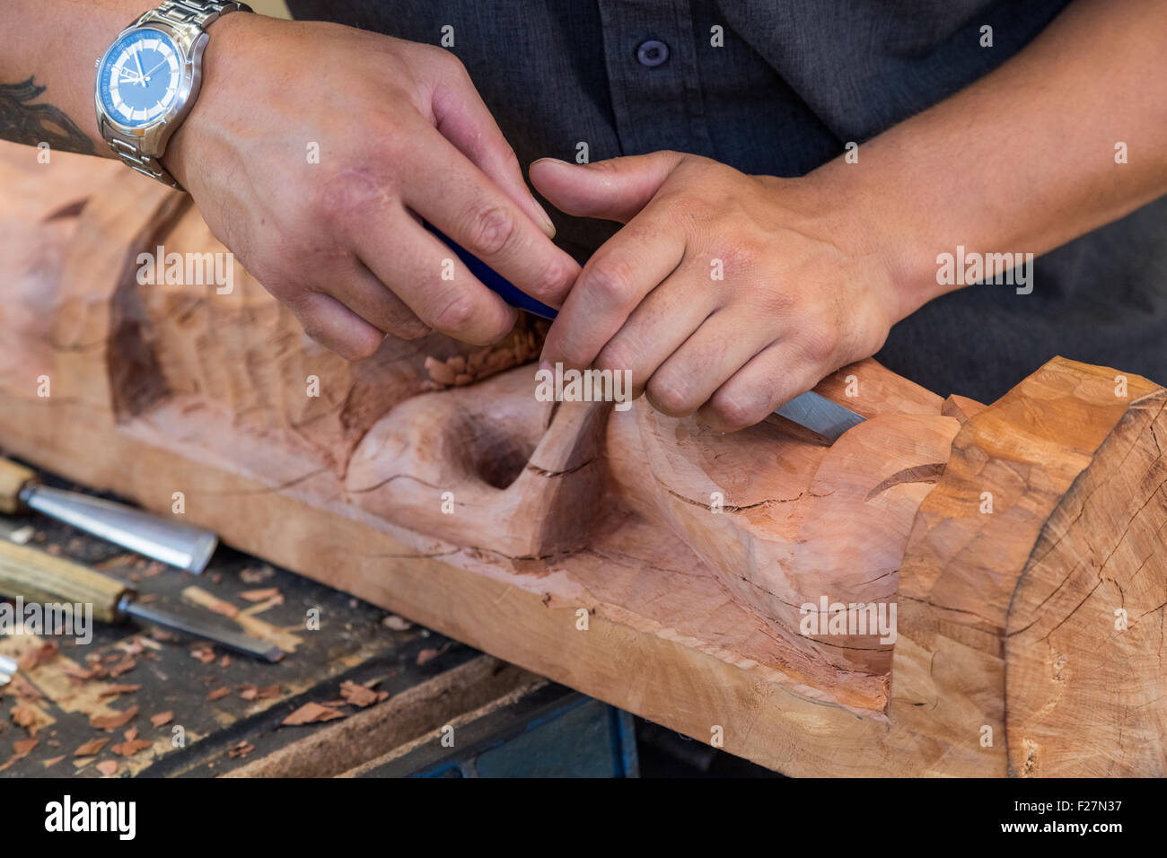 A Maori statue carving in its early stages at a carpentry in Te Puia, Rotorua, New Zealand Stock Photo