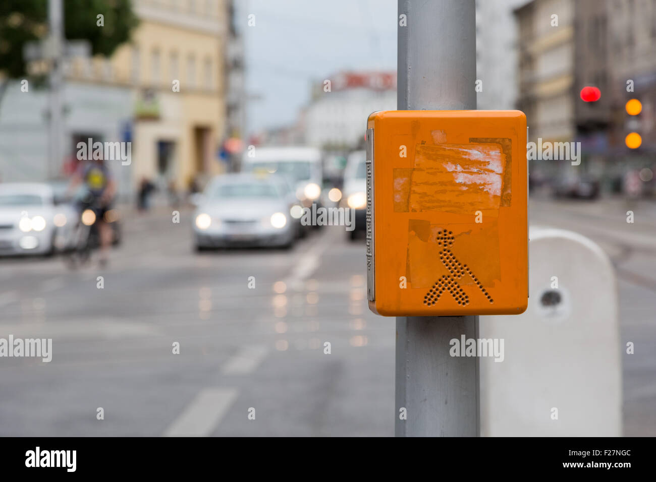 An orange acoustic signal system for blind people on a zebra crossing Stock Photo