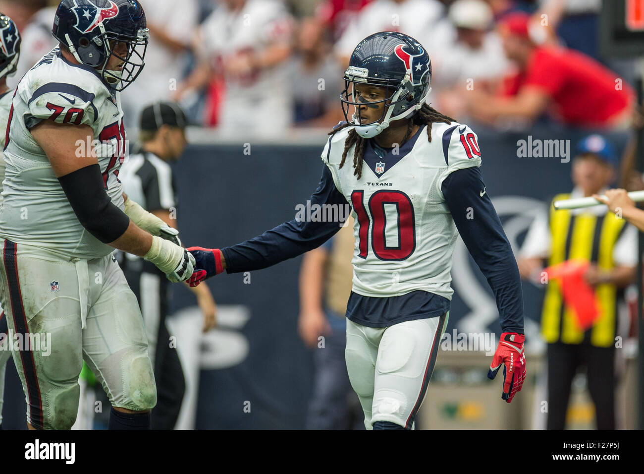 Houston, Texas, USA. 13th Sep, 2015. Houston Texans wide receiver DeAndre Hopkins (10) celebrates with Houston Texans tackle Jeff Adams (70) after making a catch for a 2 point conversion during the 4th quarter of an NFL game between the Houston Texans and the Kansas City Chiefs at NRG Stadium in Houston, TX on September 13th, 2015. The Chiefs won 27-20. Credit:  Trask Smith/ZUMA Wire/Alamy Live News Stock Photo