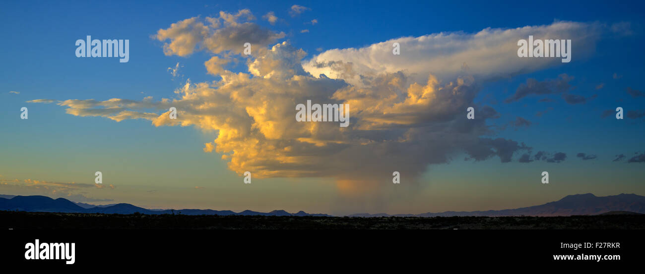 Clouds and Isolated Rainstorm over the desert of central New Mexico, USA. Stock Photo