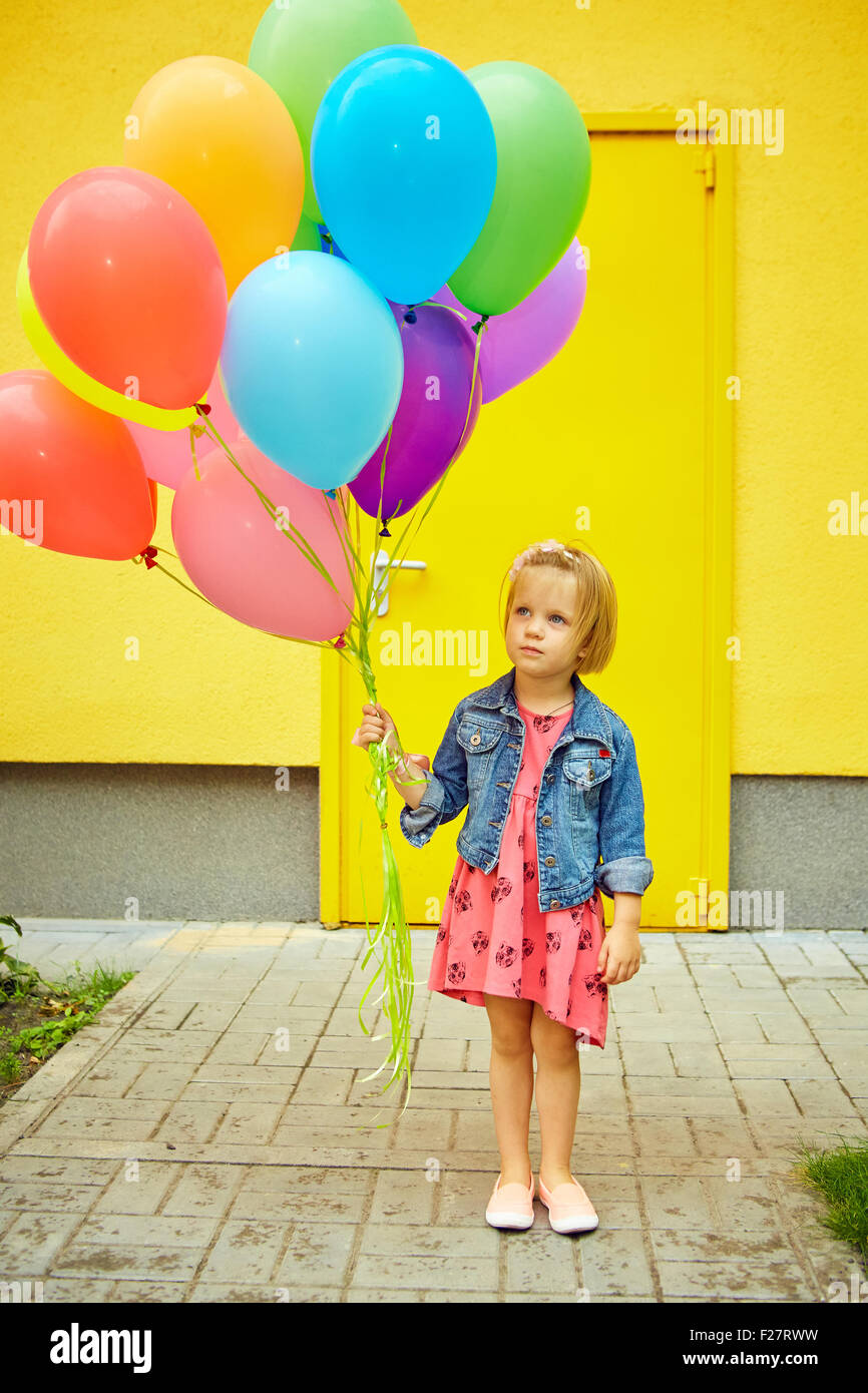 happy little girl outdoors with balloons Stock Photo - Alamy