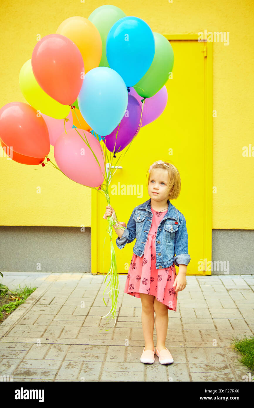 happy little girl outdoors with balloons Stock Photo - Alamy