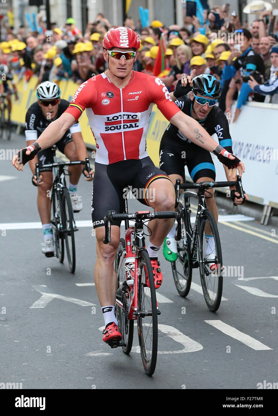 London, UK. 13th Sep, 2015. Tour of Britain Stage Eight. London Finish. Andre Greipel of Lotto Soudal celebrates winning but is unaware he is due to be stripped of the win for cutting in front of Elia Viviani of Team Sky handing the stage win to Elia Viviani of Team Sky, who punches the air, behind right Credit:  Action Plus Sports/Alamy Live News Stock Photo
