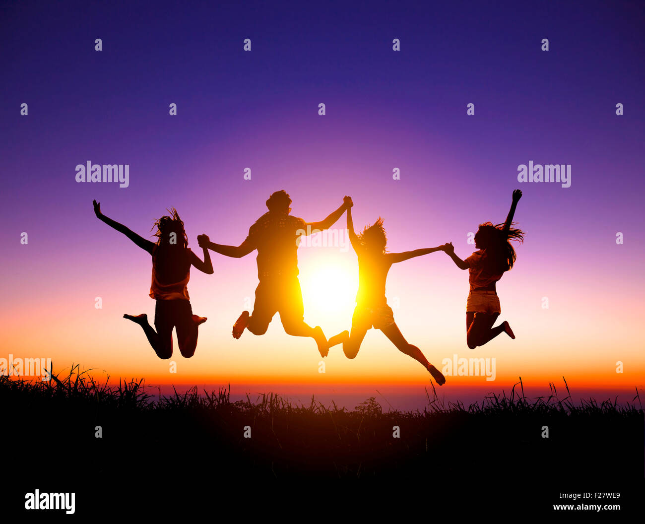 group of happy young people jumping on the mountain Stock Photo - Alamy