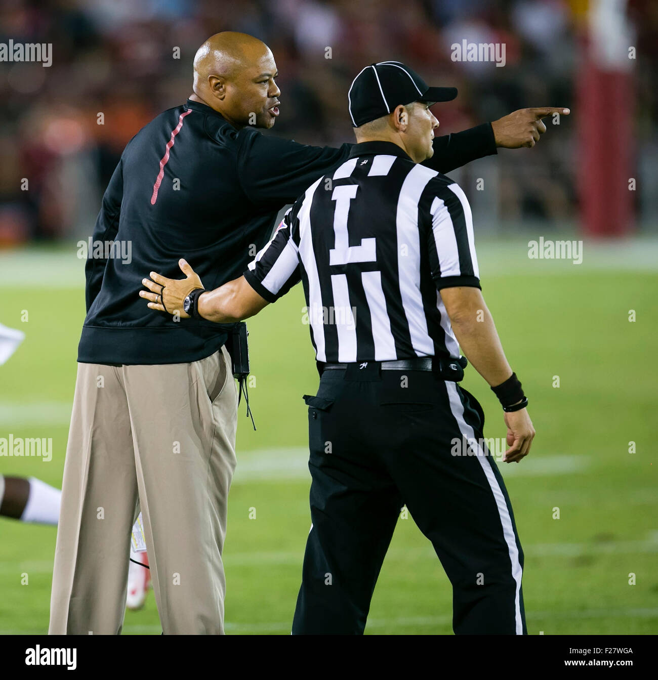 Palo Alto, CA. 12th Sep, 2015. Stanford Cardinal head coach David Shaw confers with an official during the NCAA Football game between the Stanford Cardinal and the UCF Knights at Stanford Stadium in Palo Alto, CA. Stanford defeated UCF 31-7. Damon Tarver/Cal Sport Media/Alamy Live News Stock Photo