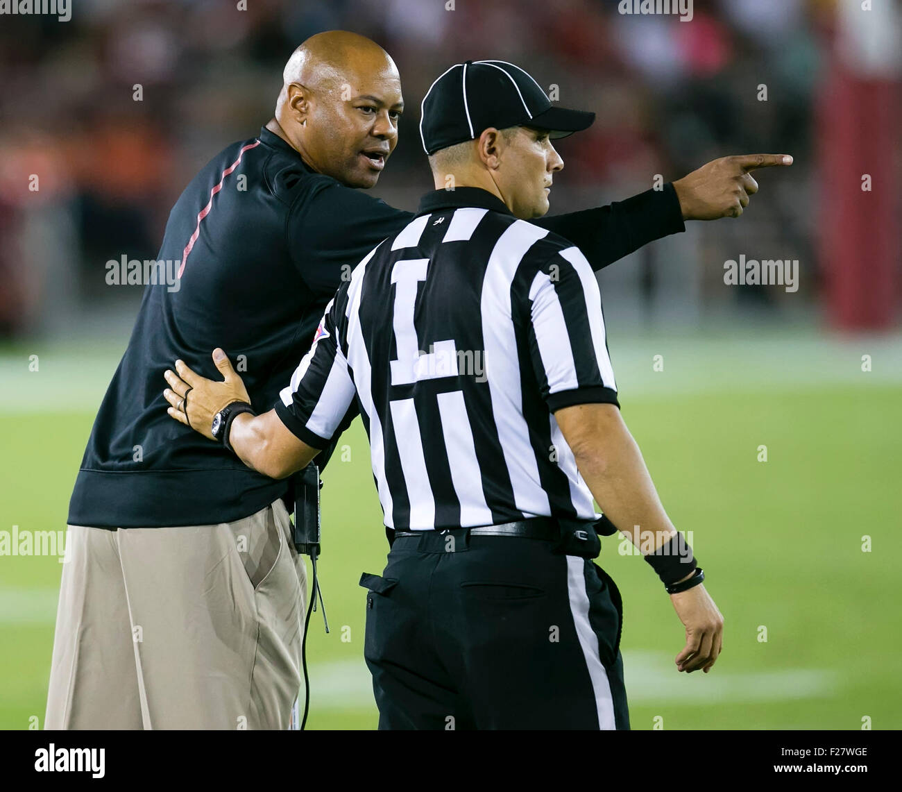 Palo Alto, CA. 12th Sep, 2015. Stanford Cardinal head coach David Shaw confers with an official during the NCAA Football game between the Stanford Cardinal and the UCF Knights at Stanford Stadium in Palo Alto, CA. Stanford defeated UCF 31-7. Damon Tarver/Cal Sport Media/Alamy Live News Stock Photo