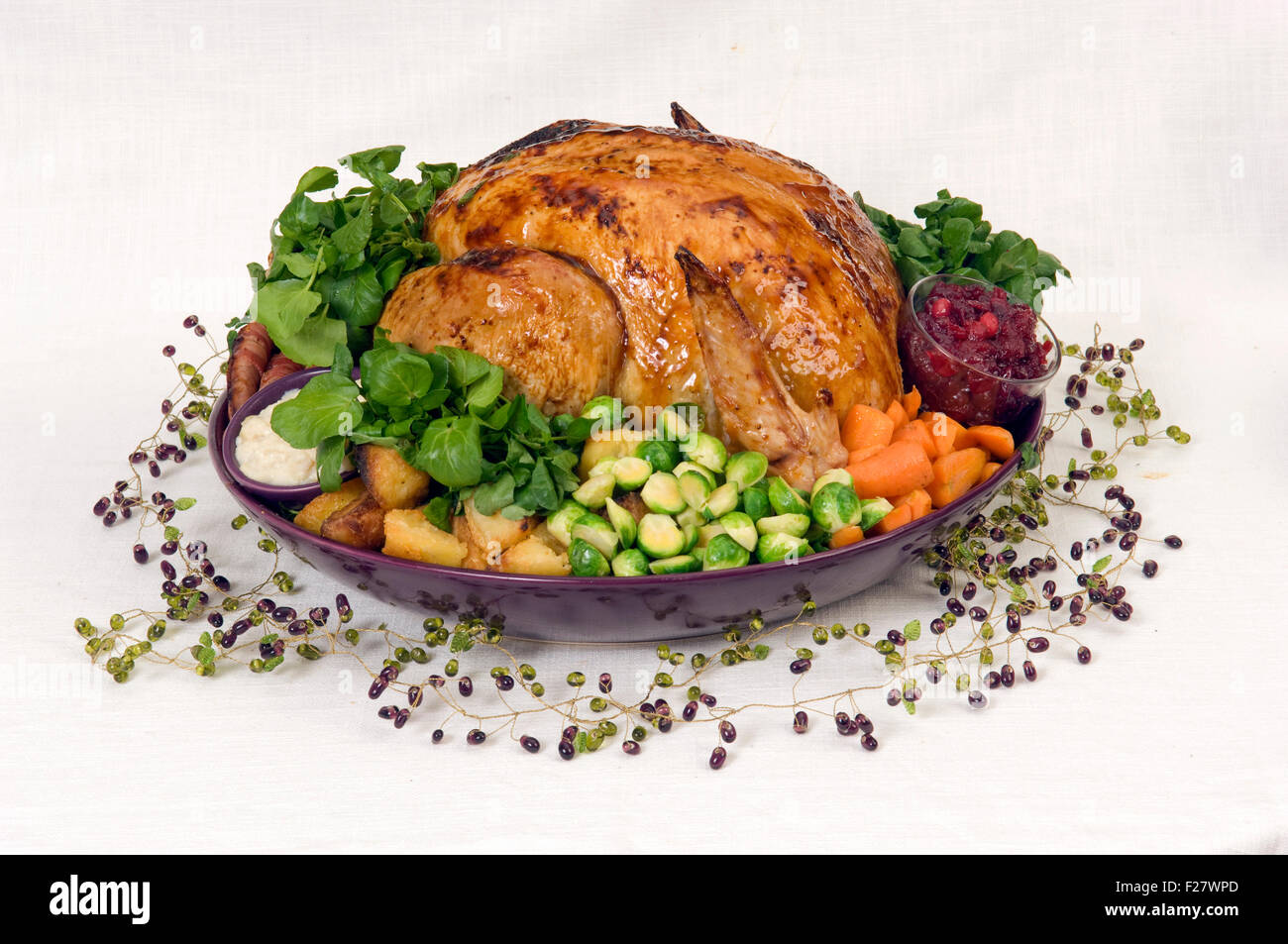 A Christmas roast turkey dinner with roast potatoes, chestnut stuffing, parsnips, cranberry