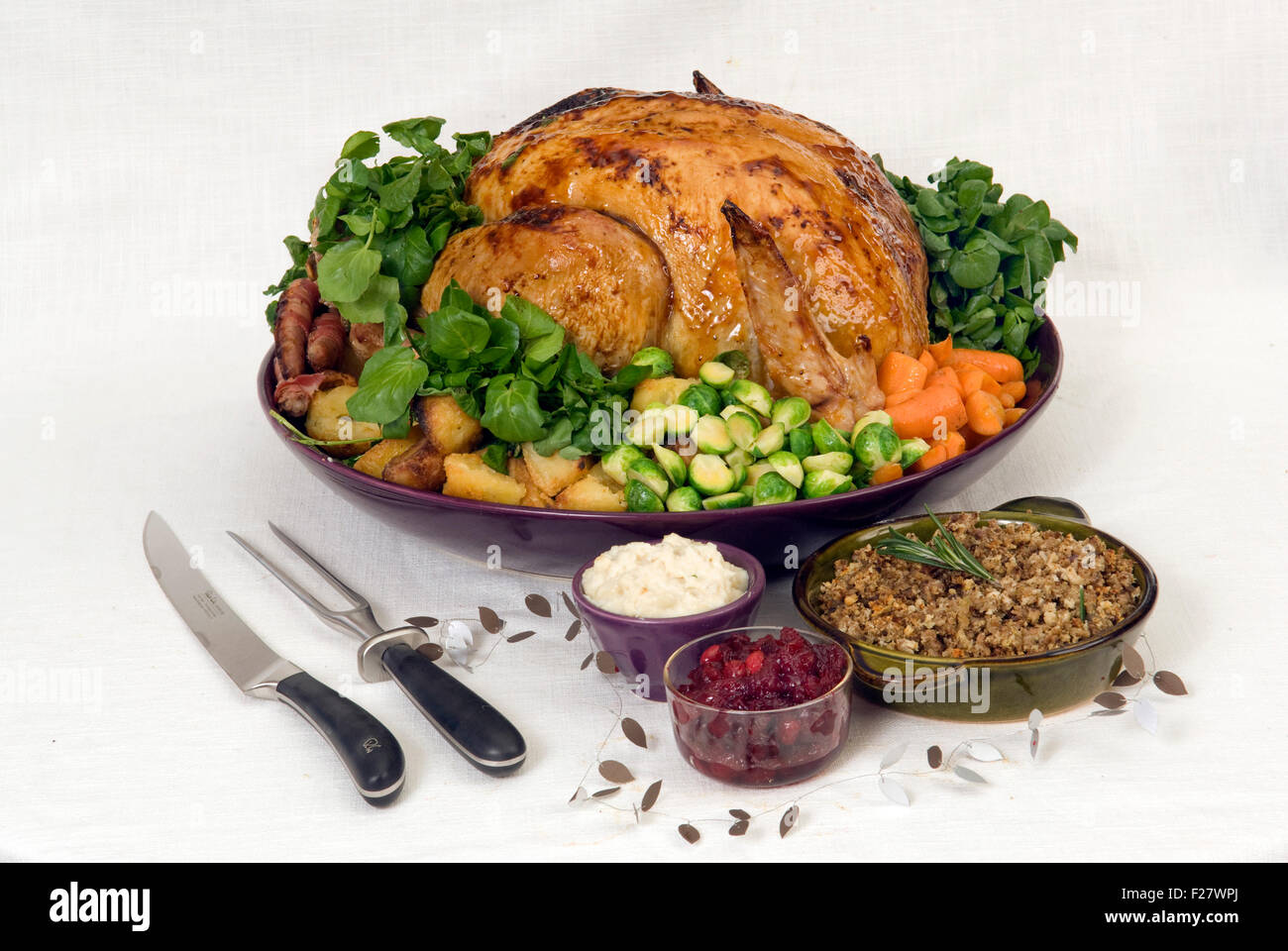 A Christmas roast turkey dinner with roast potatoes, chestnut stuffing