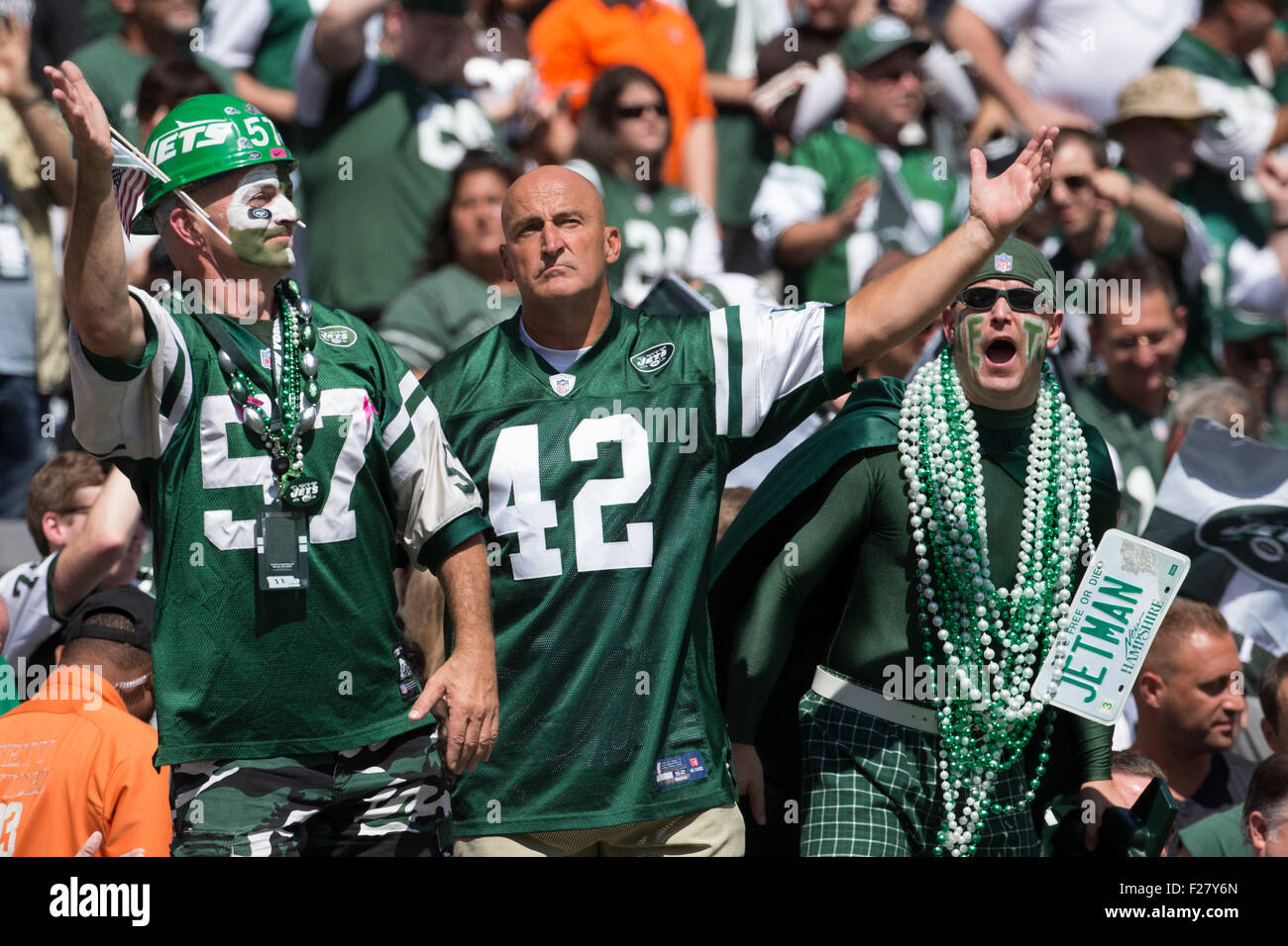 East Rutherford, New Jersey, USA. 13th Sep, 2015. New York Jets Fan Fireman Ed reacts with two other fans prior to the NFL game between the Cleveland Browns and the New York Jets at MetLife Stadium in East Rutherford, New Jersey. The New York Jets won 31-10. Christopher Szagola/CSM/Alamy Live News Stock Photo