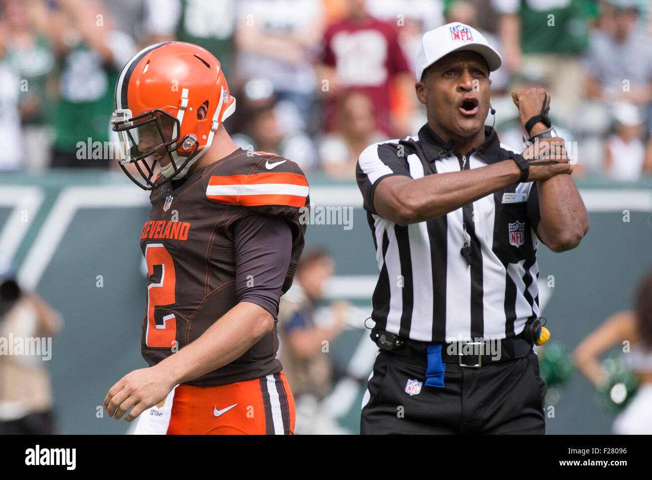 East Rutherford, New Jersey, USA. 13th Sep, 2015. Cleveland Browns  quarterback Johnny Manziel (2) hangs his head as referee Jerome Boger (23)  calls holding against the Browns during the NFL game between