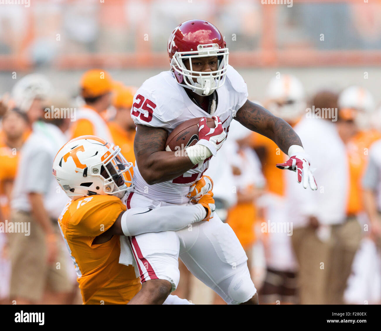 September 12, 2015: Joe Mixon #25 of the Oklahoma Sooners runs the ball  while Malik Foreman #13 of the Tennessee Volunteers tries to tackle him  during the NCAA Football game between the University of Tennessee  Volunteers and the Oklahoma ...