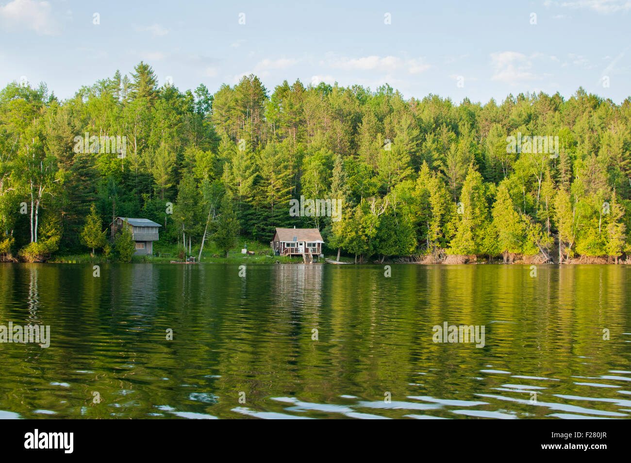 Lonely wooden cottages on a northern Ontario lake, Canada Stock Photo